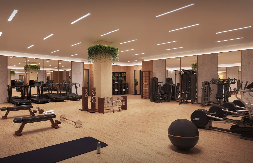 215 West 28th Street, Unit 4E Manhattan, NY 10001 - Photo 7 of 13 a room with gym equipment and mirrors