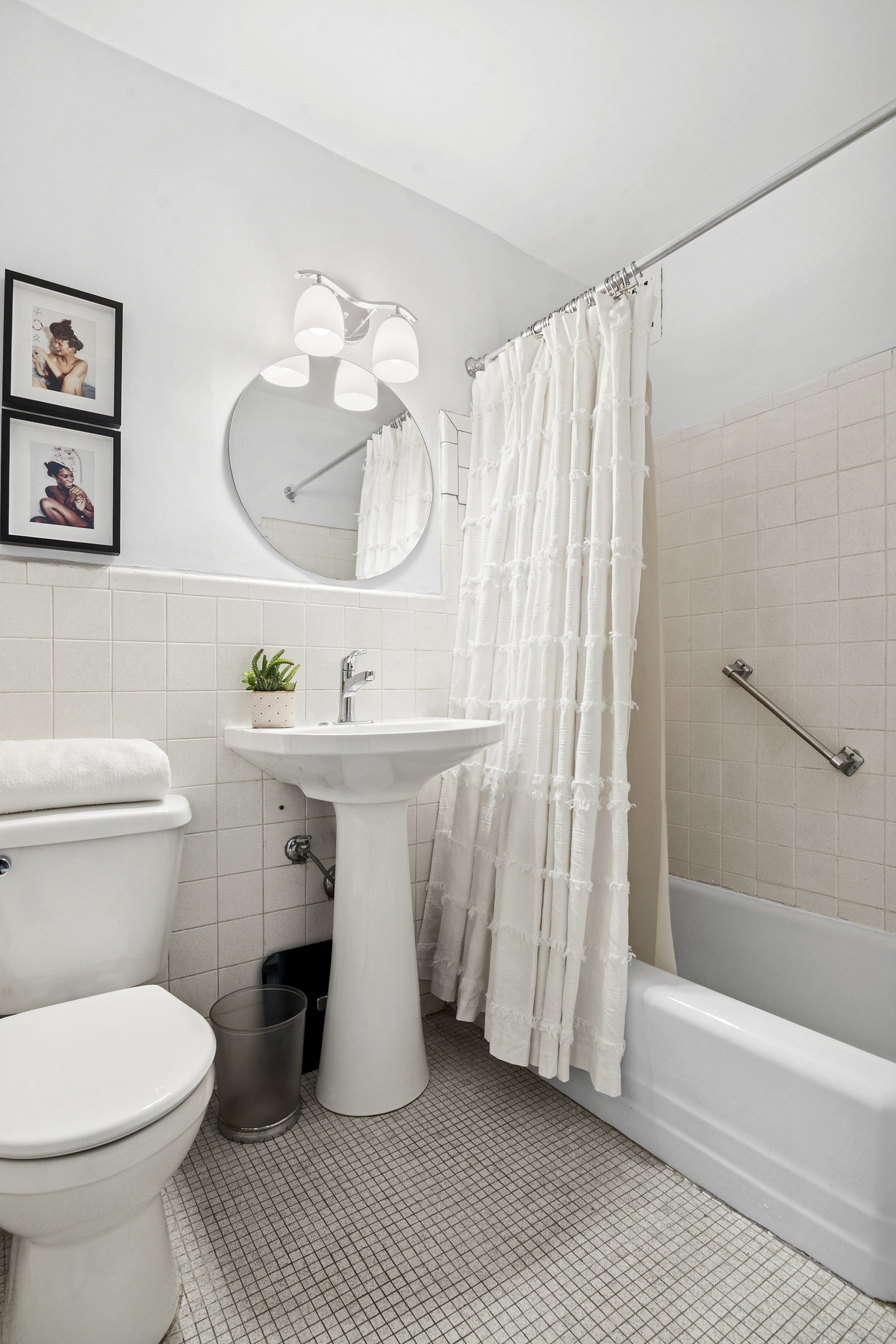 195 Willoughby Avenue, Unit 1206 Brooklyn, NY 11205 - Photo 5 of 10 a bathroom with a sink toilet and shower