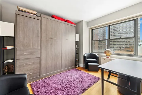 a living room with furniture and a rug