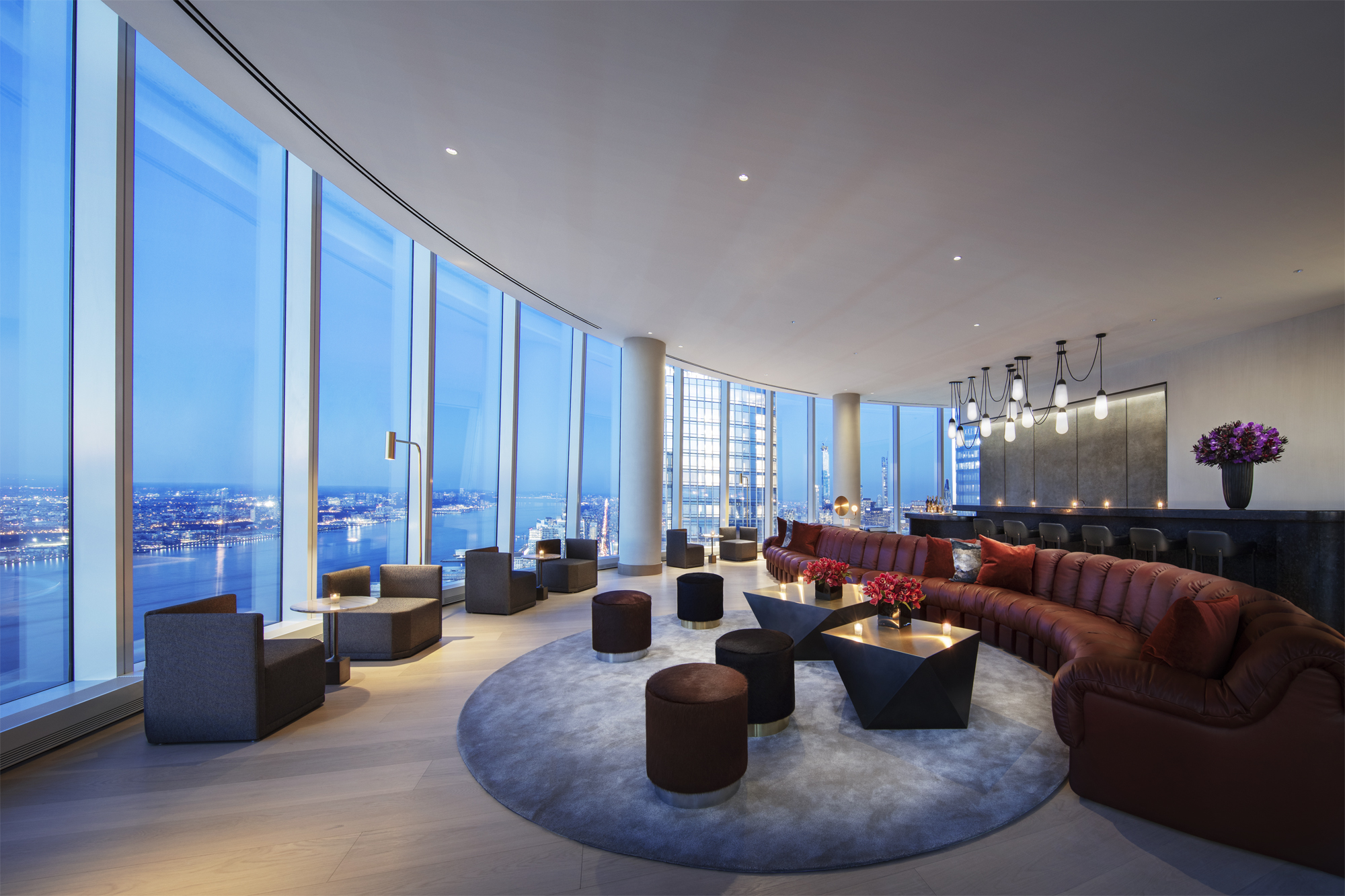15 Hudson Yards, Unit 77B Manhattan, NY 10001 - Photo 13 of 24 a living room with furniture and a large window