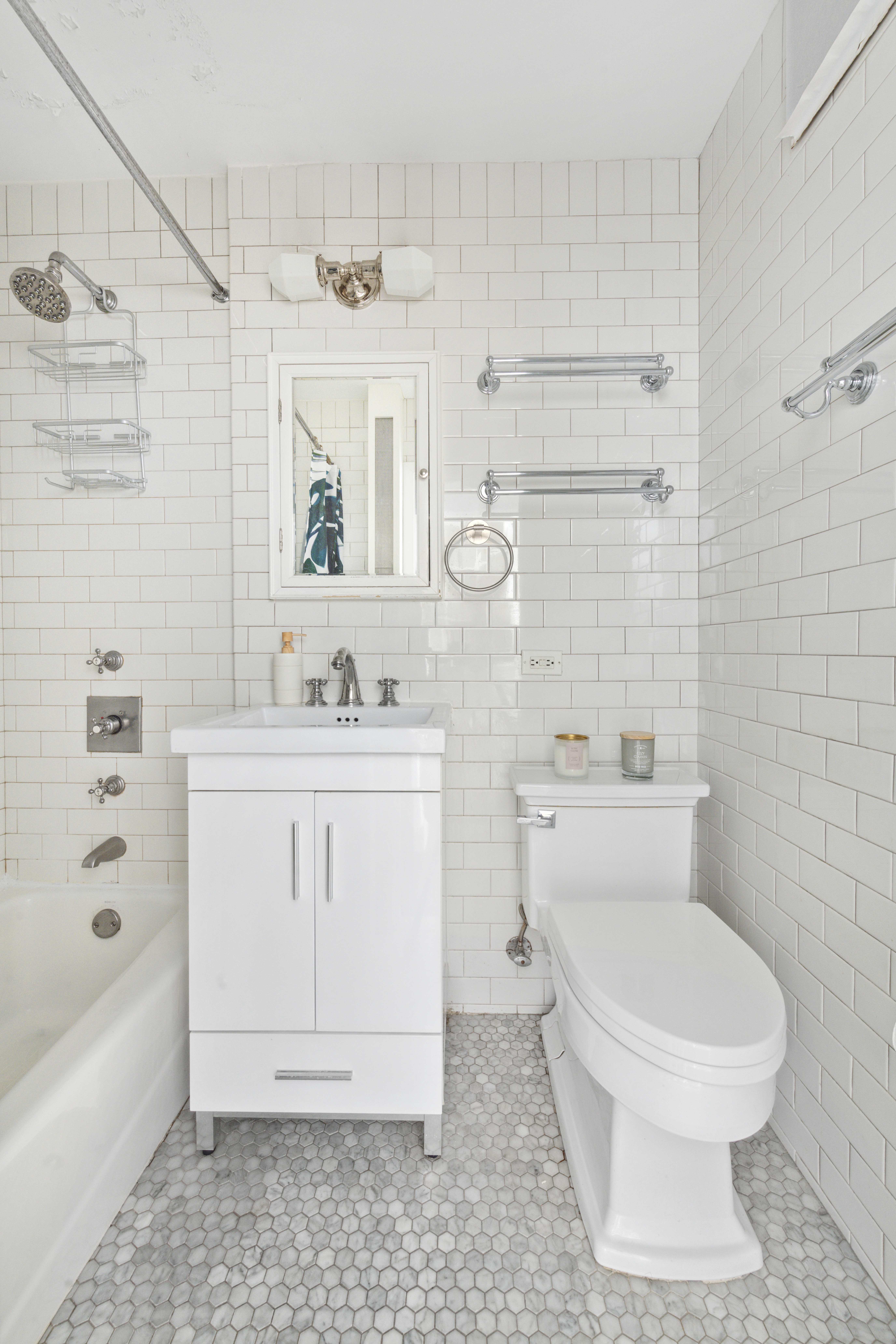 332 West 101st Street, Unit 4F Manhattan, NY 10025 - Photo 6 of 10 a bathroom with a sink a toilet and shower