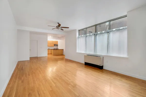 a view of an empty room with a window
