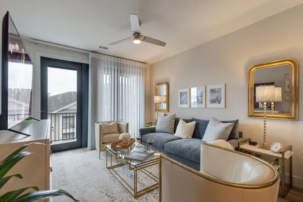 a living room with furniture and a window