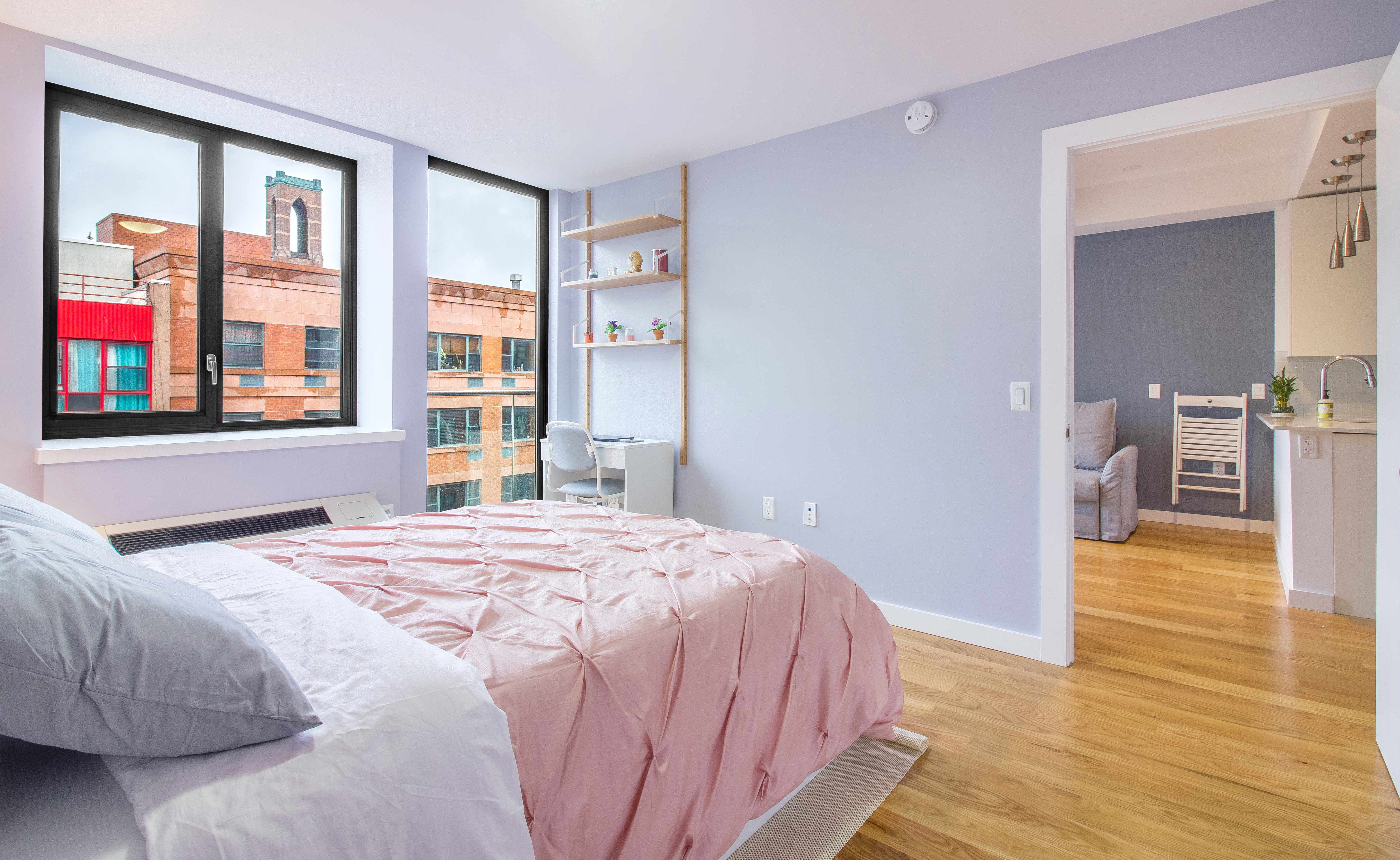 51 East 131st Street, Unit 6A Manhattan, NY 10037 - Photo 9 of 12 a bedroom with a bed and wooden floor