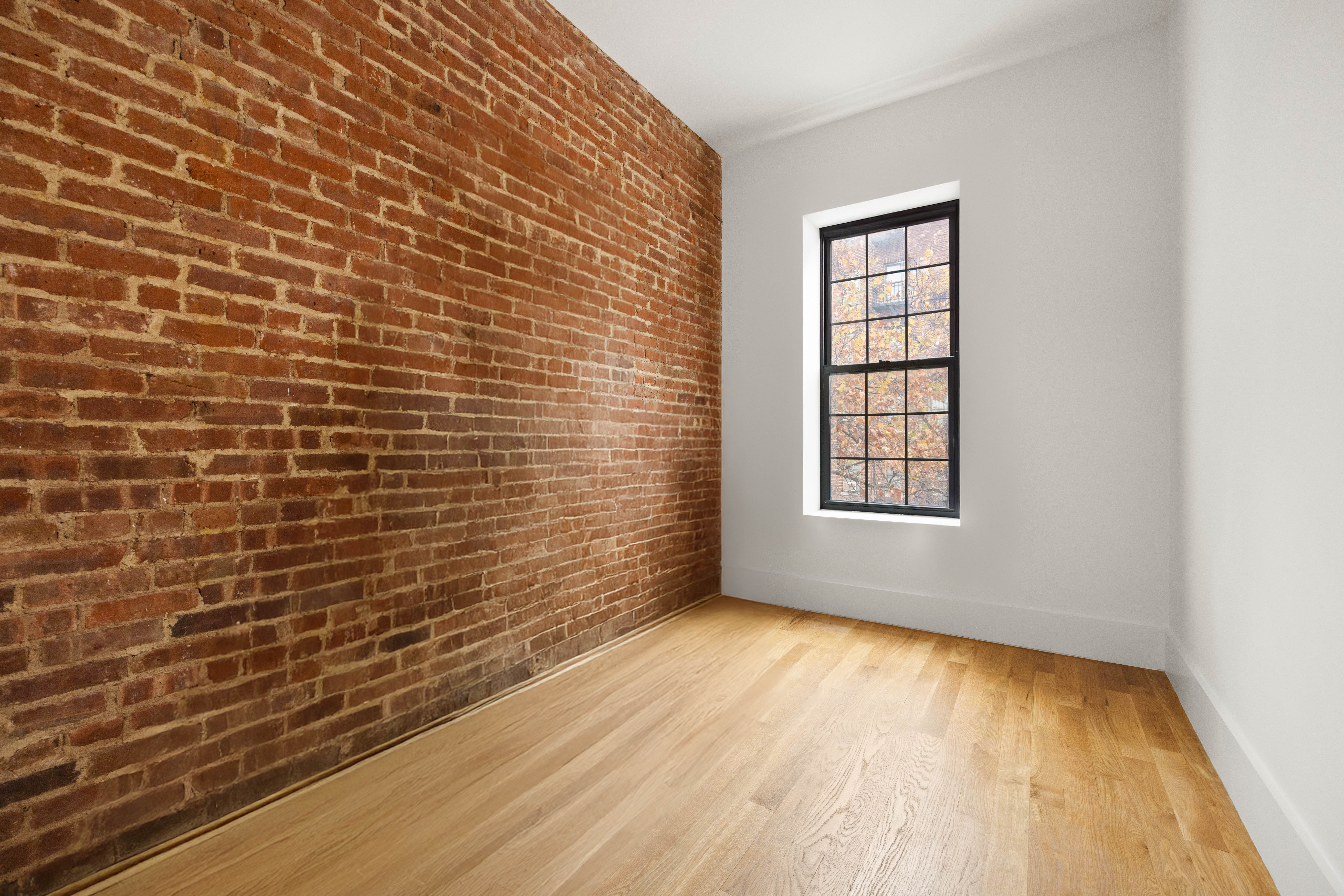 750 Lincoln Place Brooklyn, NY 11216 - Photo 13 of 24 a view of an empty room with a window