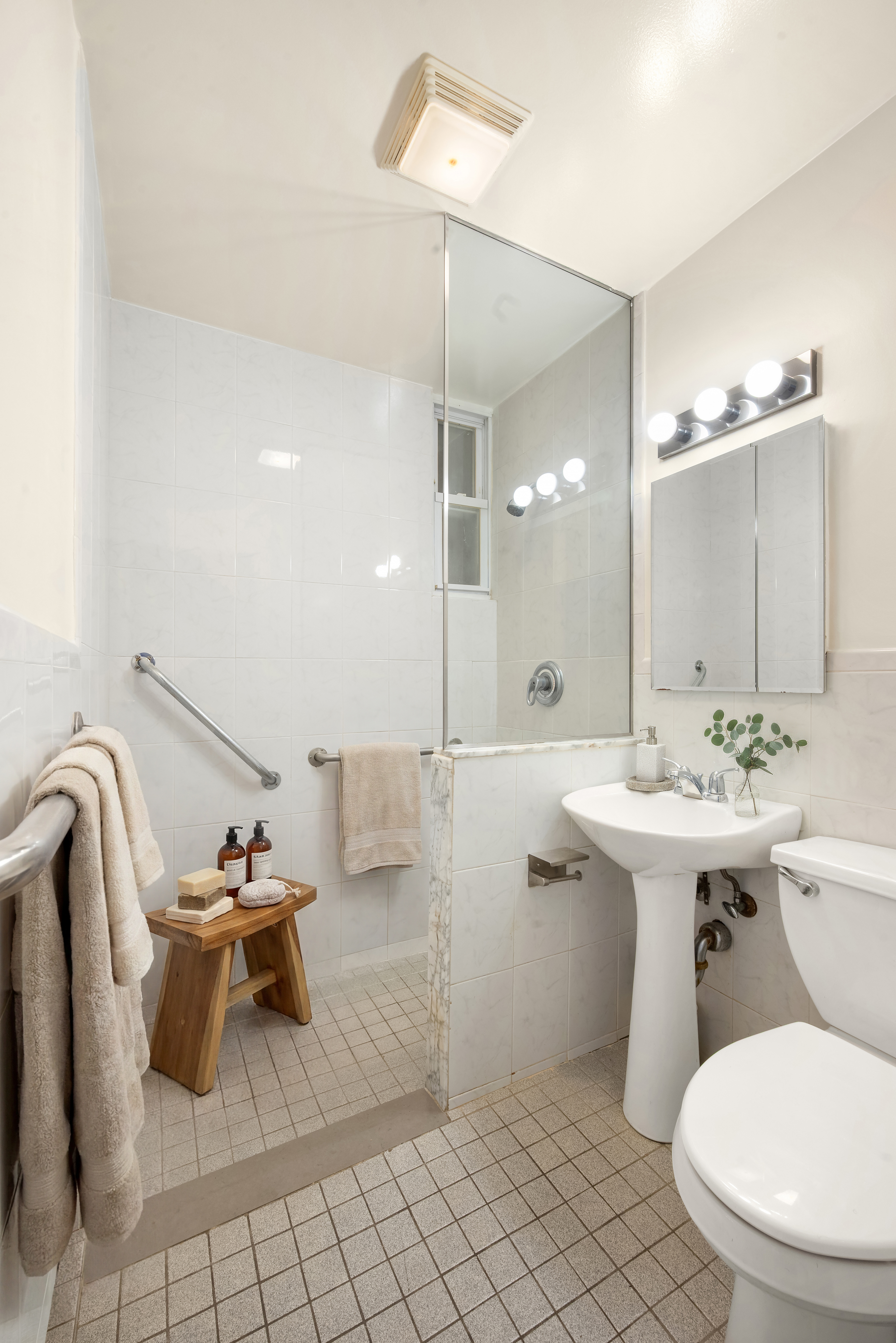 590 Manhattan Avenue, Unit 1 Brooklyn, NY 11222 - Photo 4 of 4 a bathroom with a sink toilet and shower