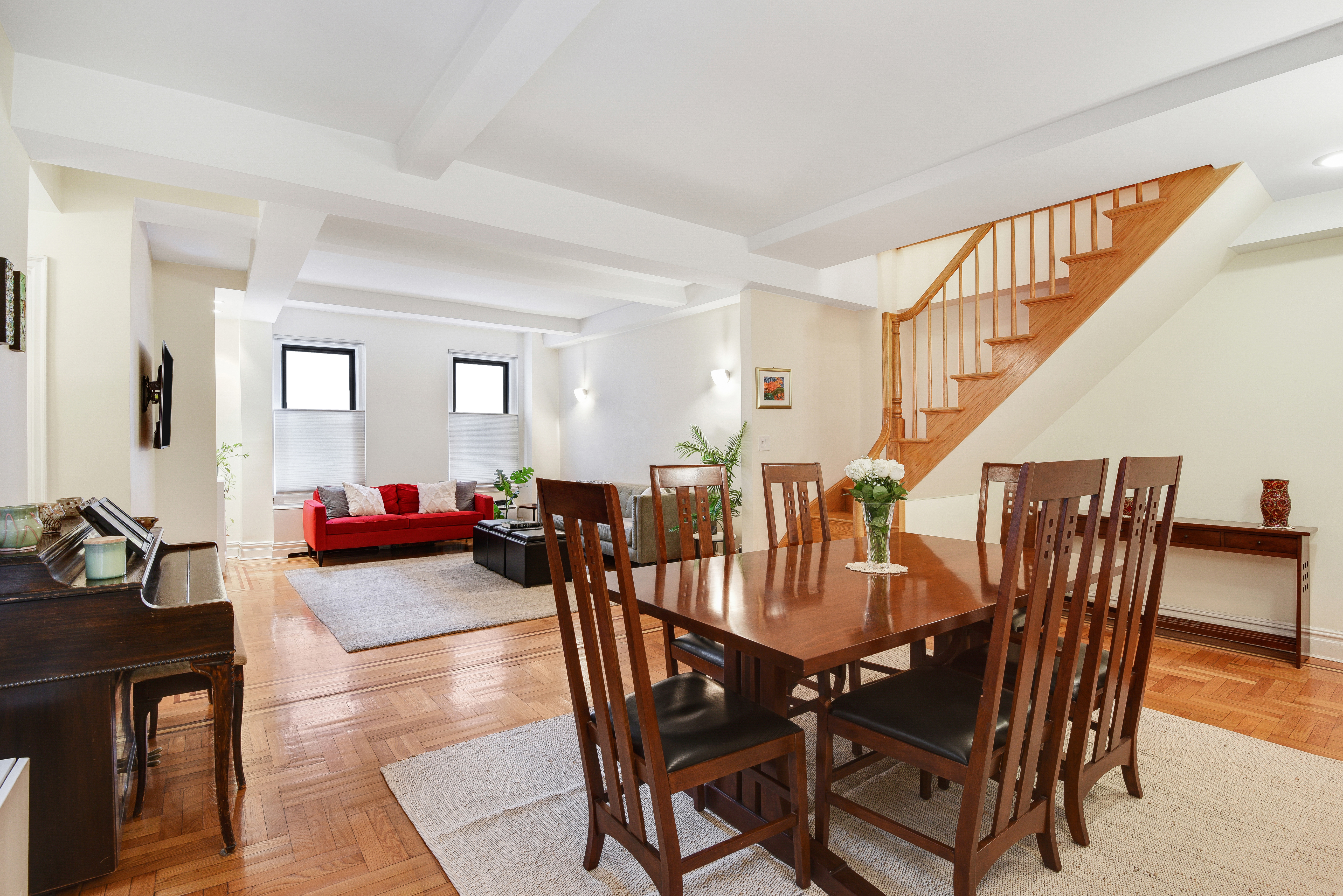 321 West 90th Street, Unit 2F Manhattan, NY 10024 - Photo 2 of 16 a view of a dining room and livingroom with furniture wooden floor and a rug