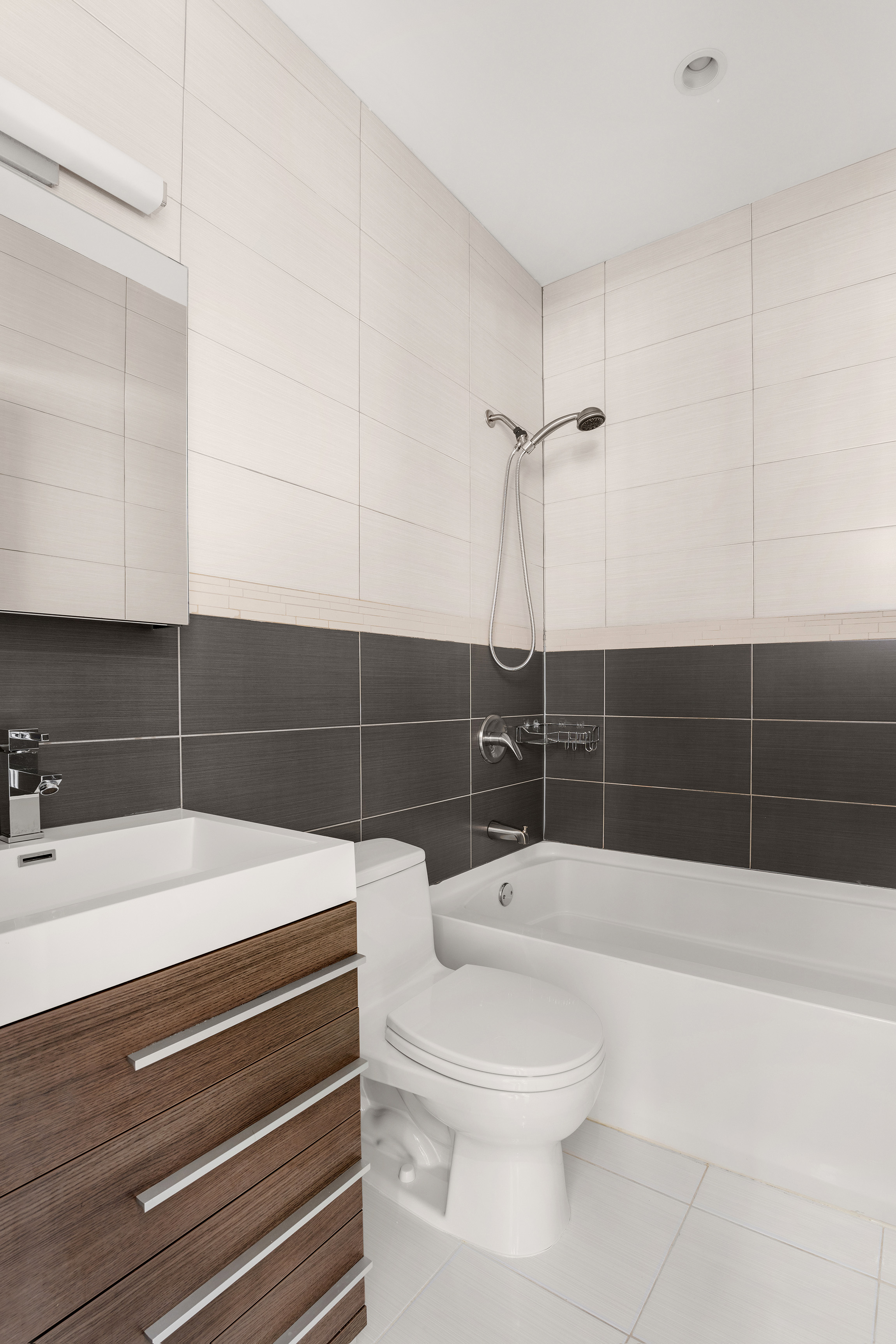 71 Irving Place, Unit 1 Brooklyn, NY 11238 - Photo 5 of 14 a bathroom with a sink toilet and shower