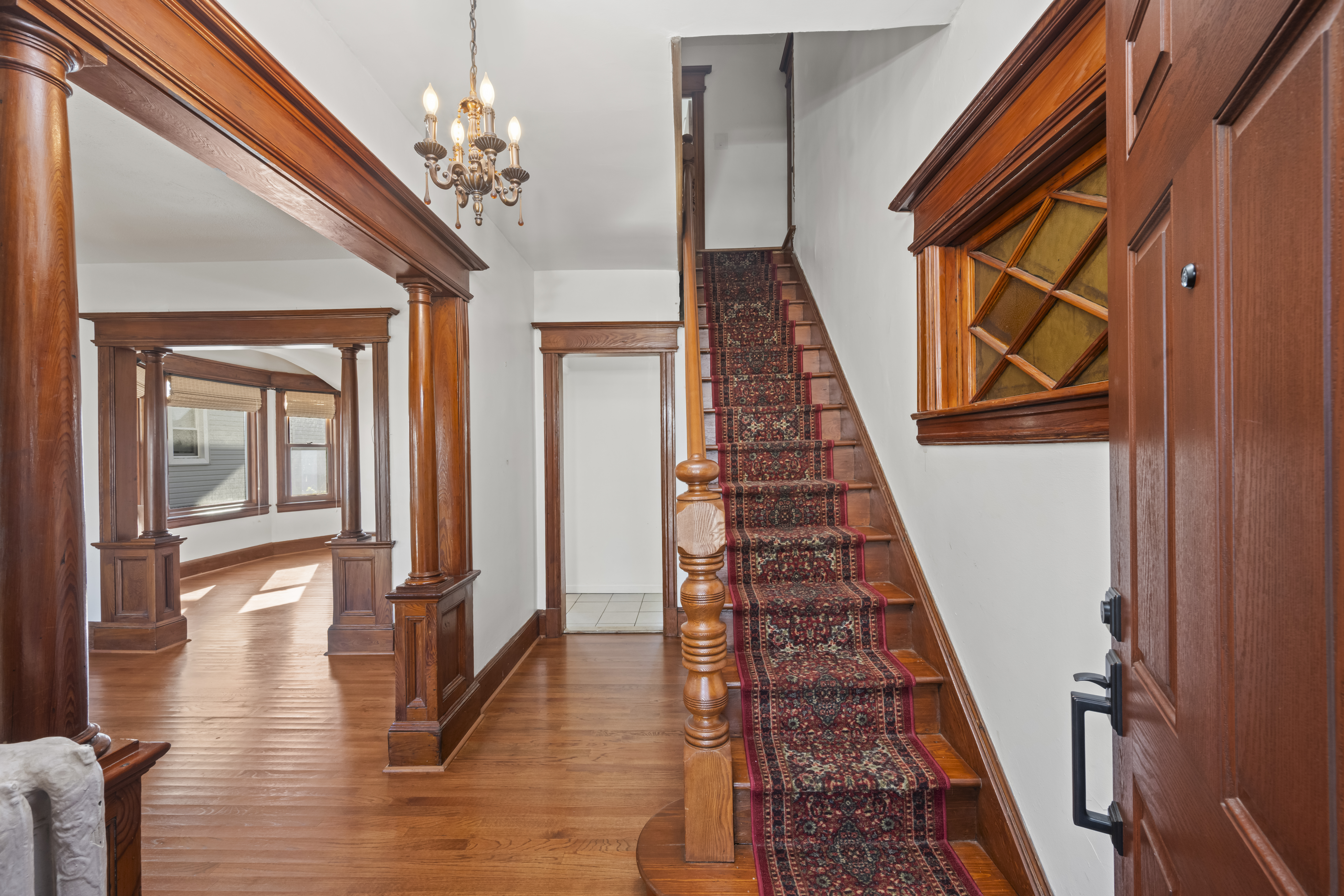 704 Delafield Avenue Staten Island, NY 10310 - Photo 5 of 35 a view of a hallway with wooden floor and staircase