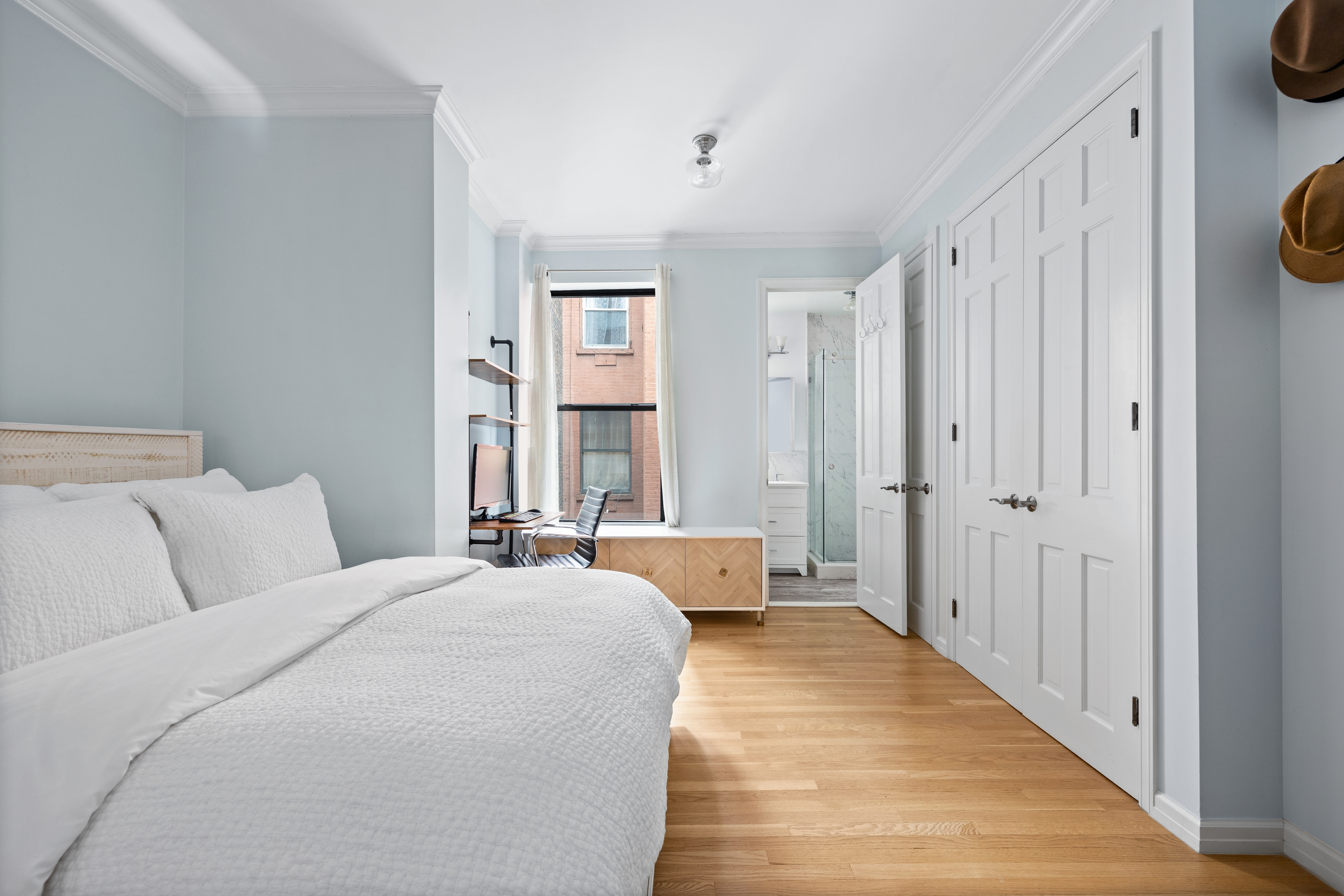 791 Greenwich Street, Unit 6 Manhattan, NY 10014 - Photo 4 of 7 a bedroom with a bed a window and a couch