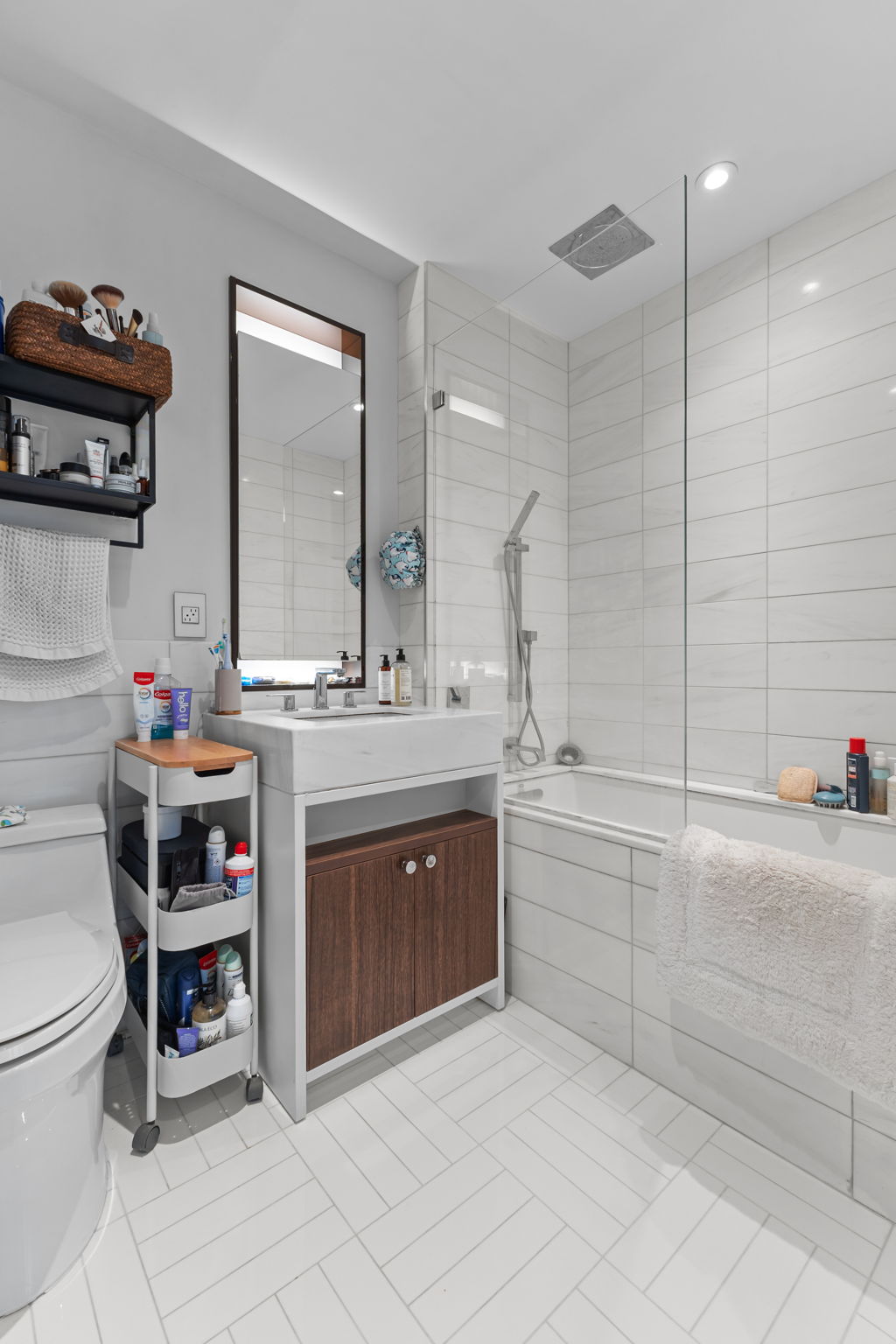 261 West 25th Street, Unit 4A Manhattan, NY 10001 - Photo 7 of 16 a bathroom with a sink vanity and toilet