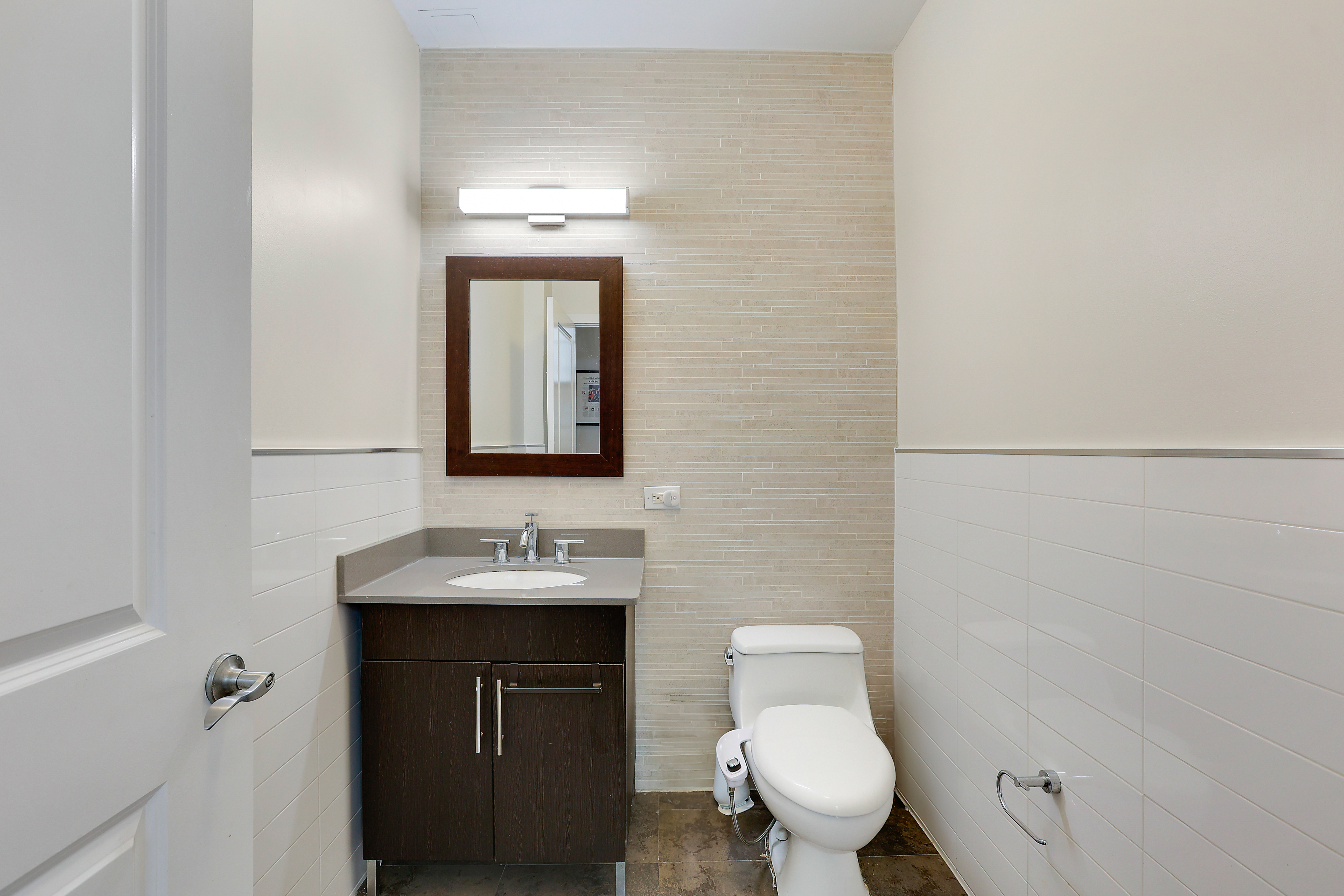 313 West 119th Street, Unit PHE Manhattan, NY 10027 - Photo 12 of 19 a bathroom with a toilet sink and mirror