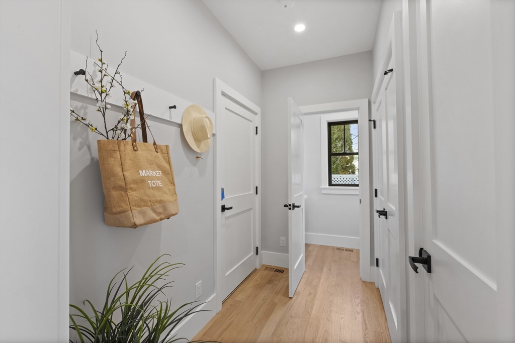 10 Webber Avenue, Unit 3C Bedford, MA 01730 - Photo 10 of 36 a view of a hallway with wooden floor and entryway