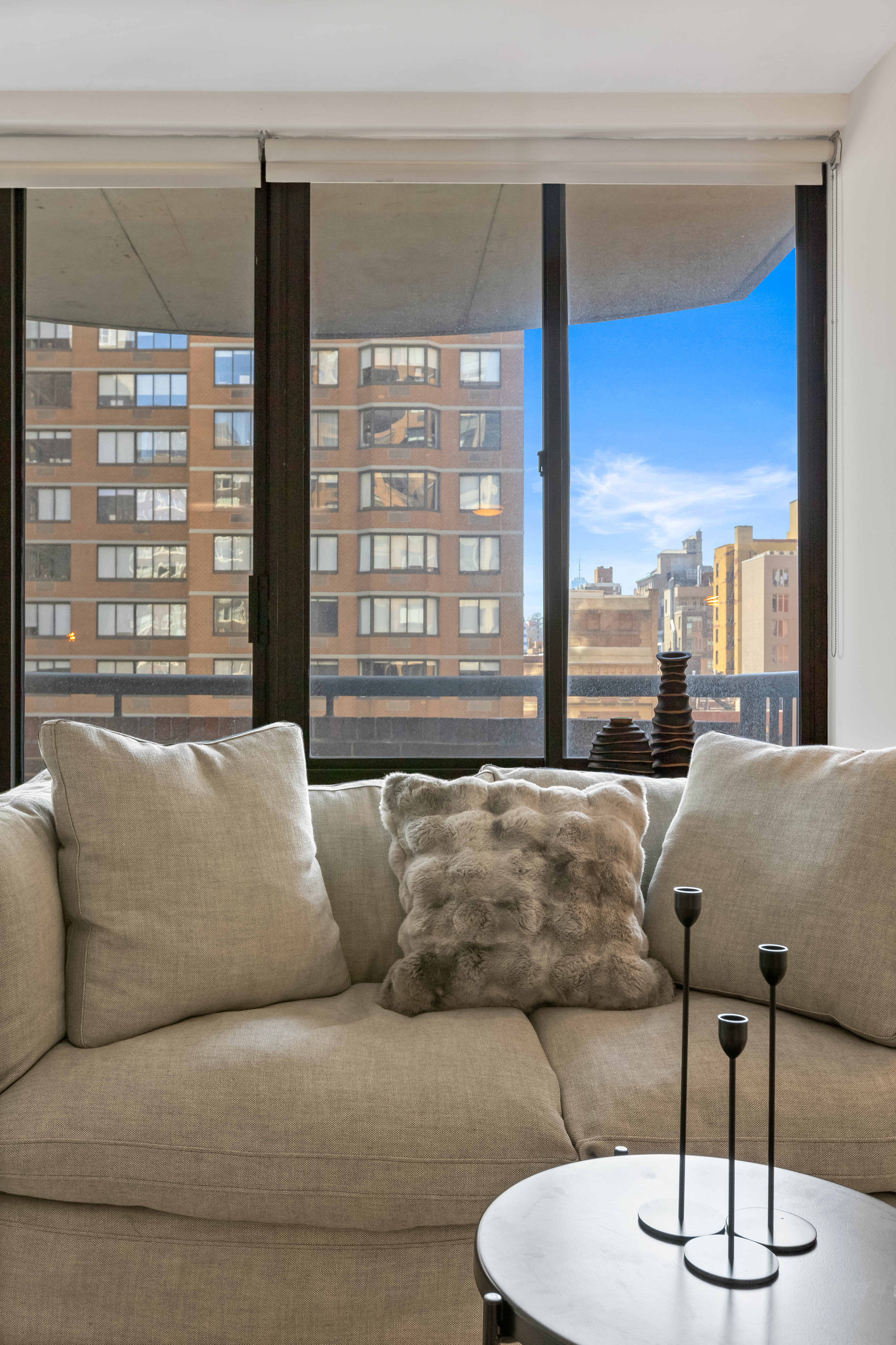 157 East 32nd Street, Unit 8A Manhattan, NY 10016 - Photo 5 of 16 a living room with furniture and a large window