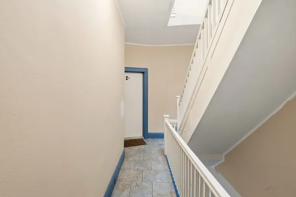 a view of a hallway with staircase