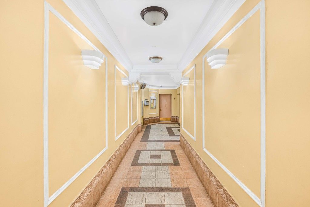 a view of a hallway with a glass door