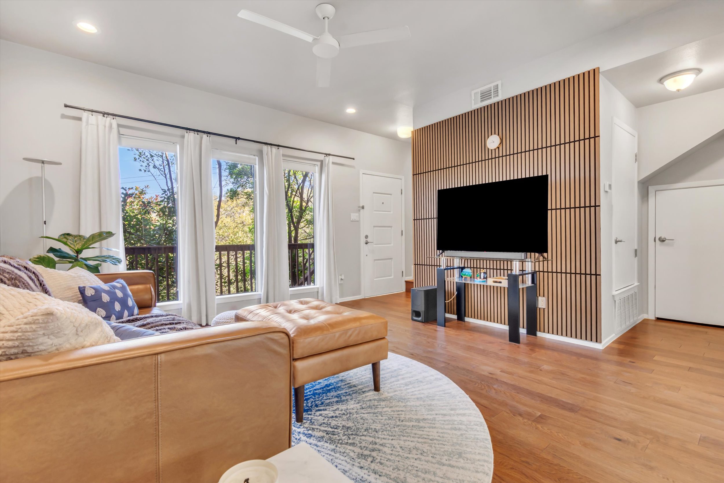 3601 Las Colinas Drive, Unit C Austin, TX 78731 - Photo 2 of 33 a living room with furniture and a flat screen tv