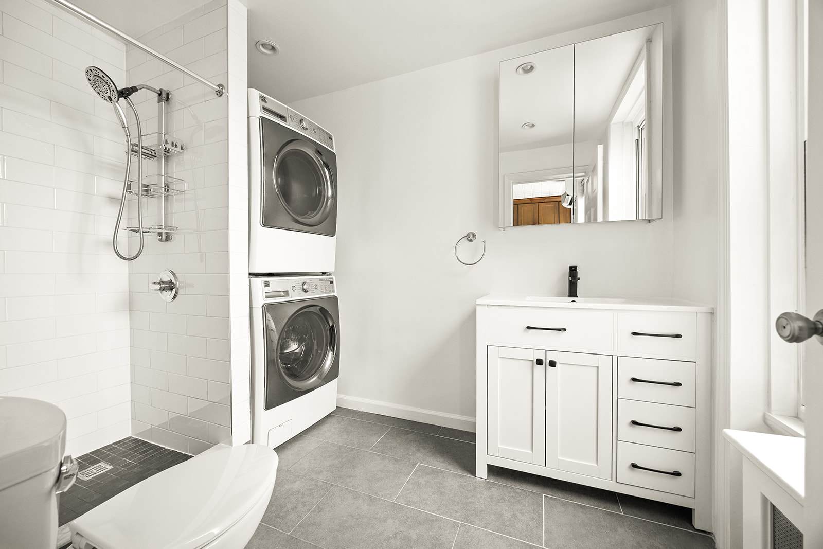 616 Carroll Street, Unit 2 Brooklyn, NY 11215 - Photo 12 of 15 a bathroom with a sink a washer and dryer