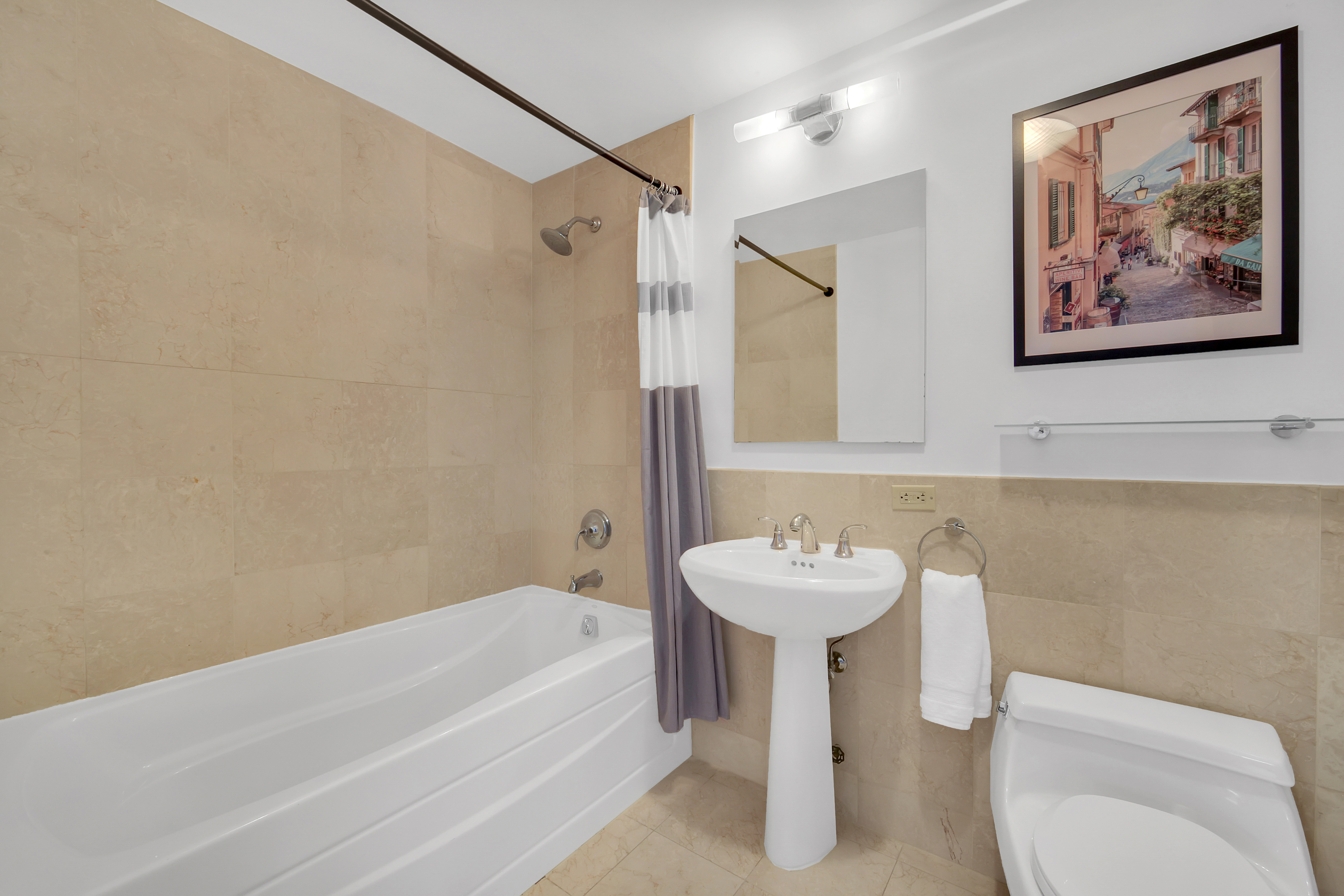 1485 5th Avenue, Unit 18/19H Manhattan, NY 10035 - Photo 16 of 24 a bathroom with a sink and a mirror