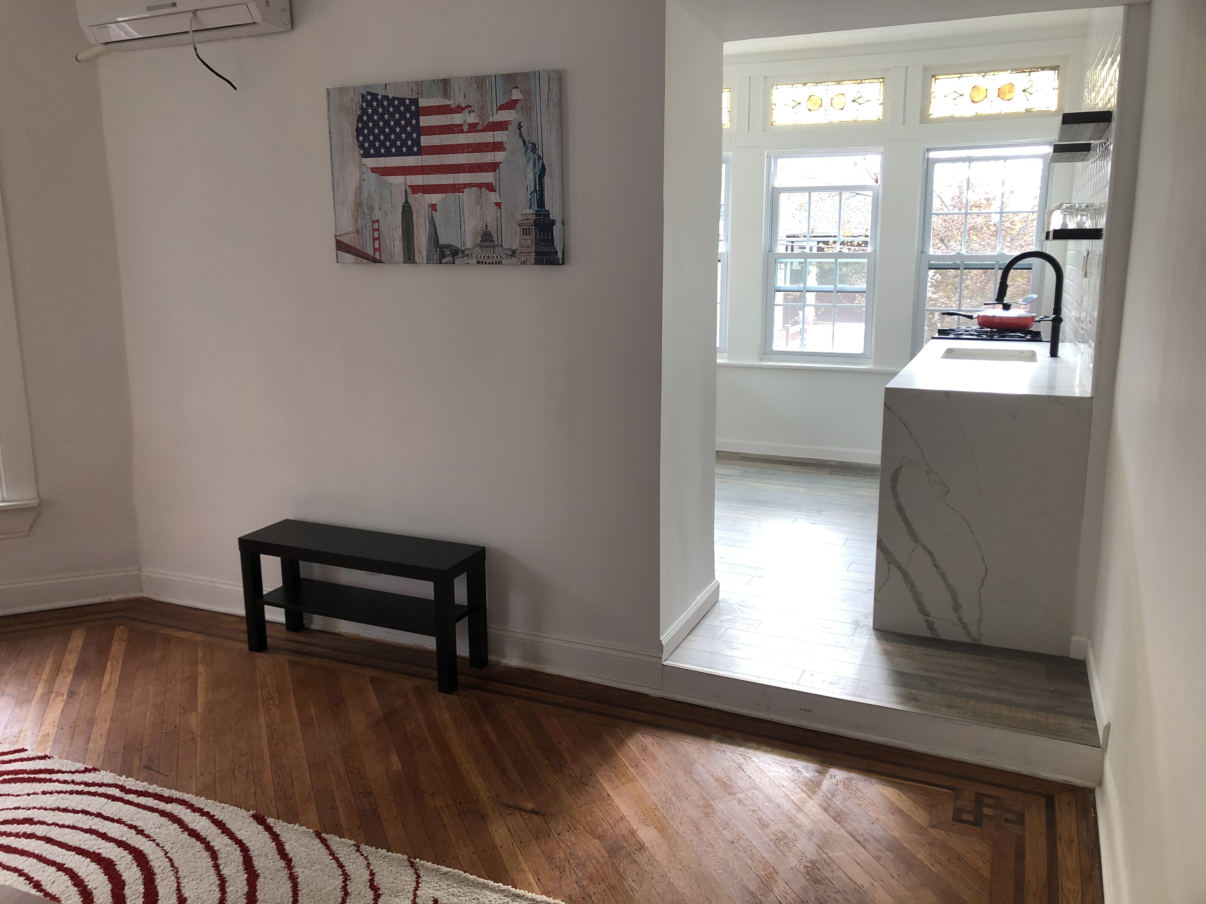 1112 Beverley Road Brooklyn, NY 11218 - Photo 20 of 53 a view of room with window and wooden floor