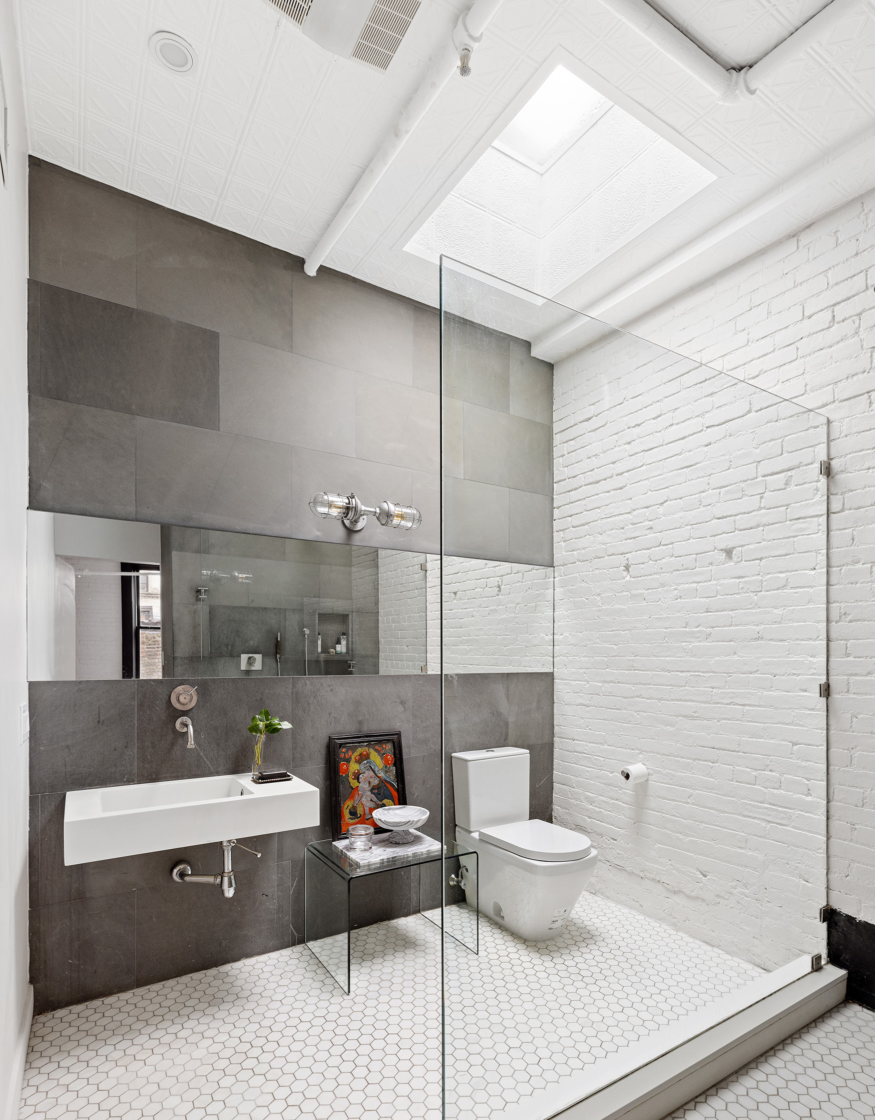 22 East 18th Street, Unit PH6B Manhattan, NY 10003 - Photo 7 of 13 a living room with furniture and a potted plant