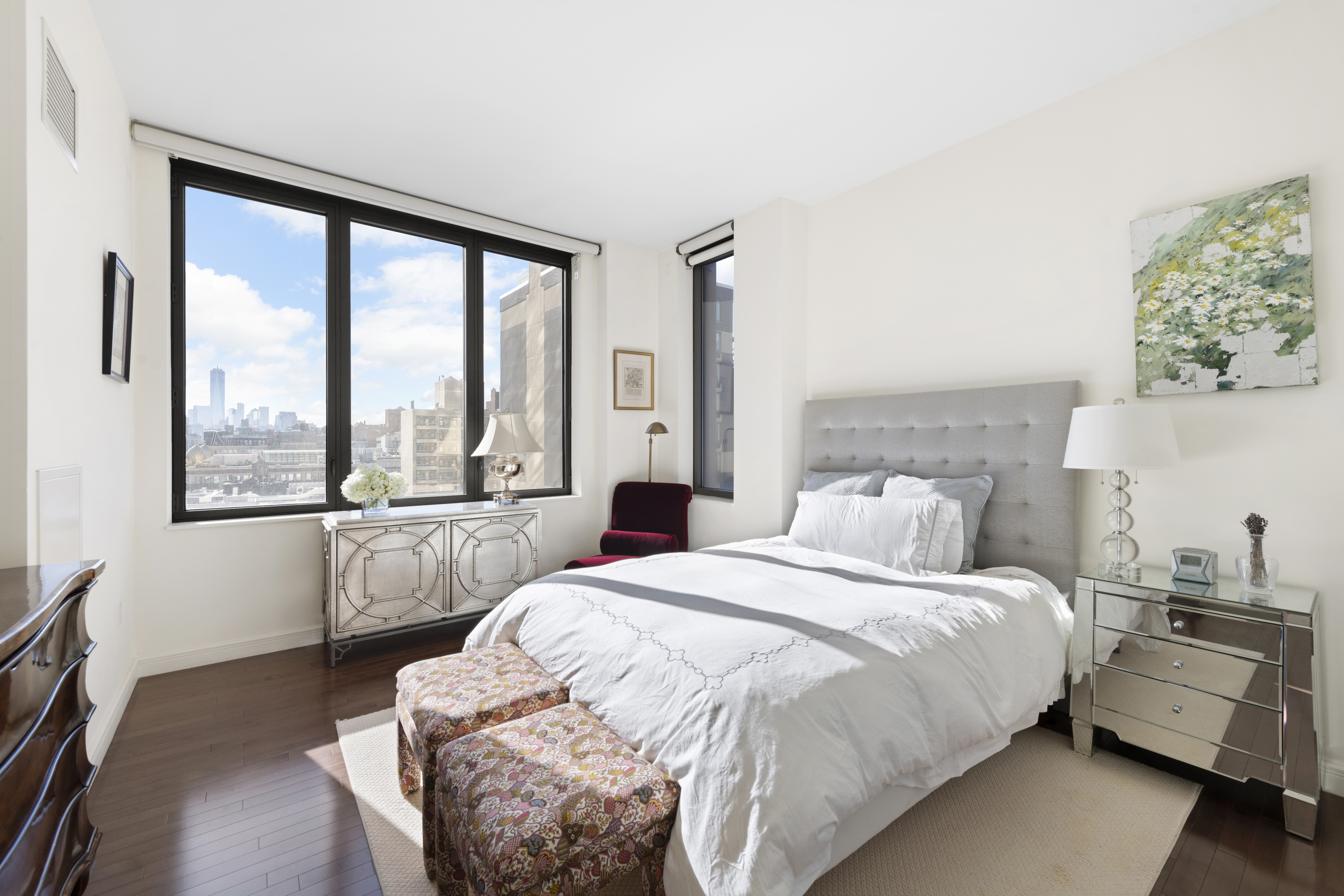 101 West 24th Street, Unit 12C Manhattan, NY 10011 - Photo 5 of 17 a bedroom with a bed and a large window