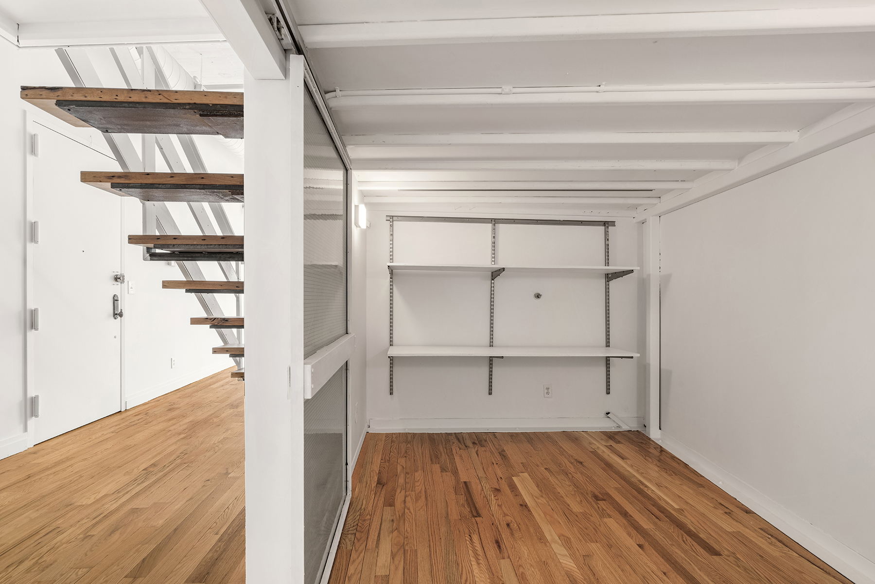 689 Myrtle Avenue, Unit 4E Brooklyn, NY 11205 - Photo 14 of 21 a view of walk in closet with empty racks