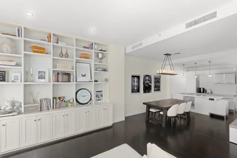a view of a dining room with furniture wooden floor and chandelier