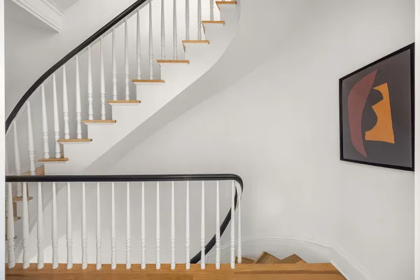 a kitchen with a table chairs refrigerator and cabinets