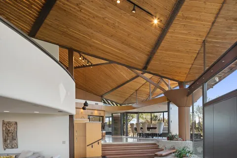 a room with patio outer view and wooden floor