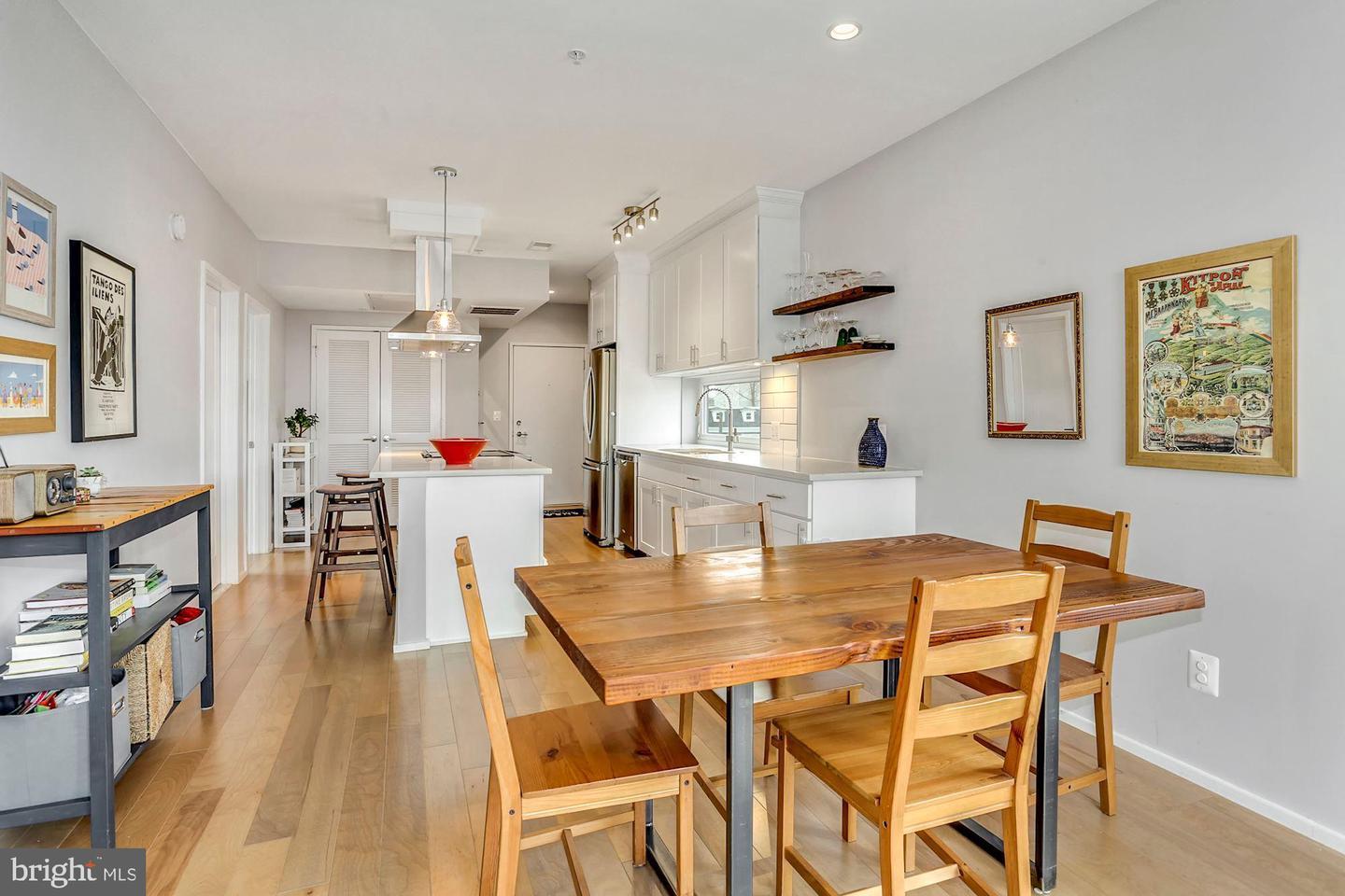 129 Varnum Street Northwest, Unit 6 Washington, DC 20011 - Photo 10 of 25 a dining room with furniture and wooden floor