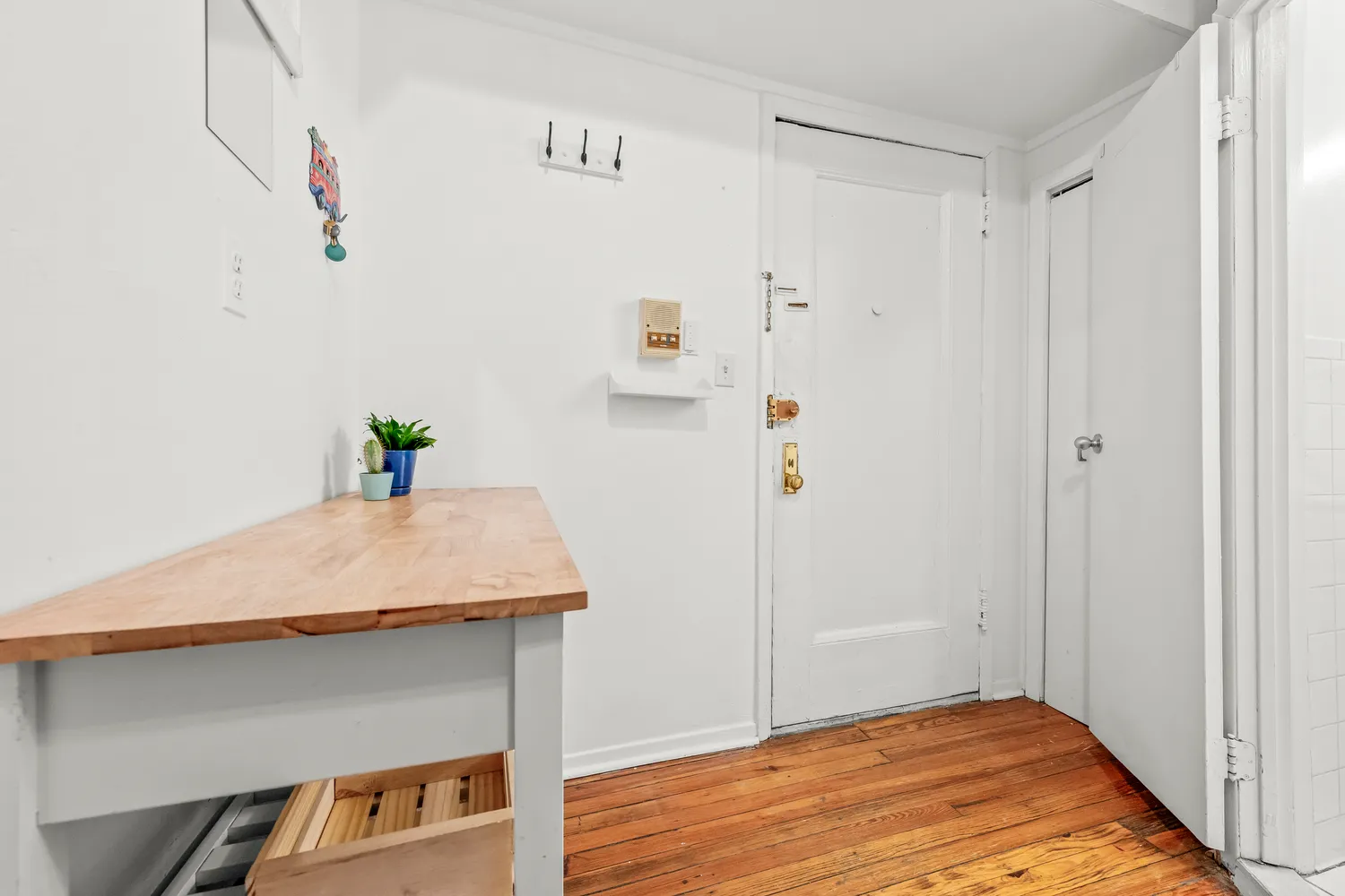 a room with a table and wooden floor