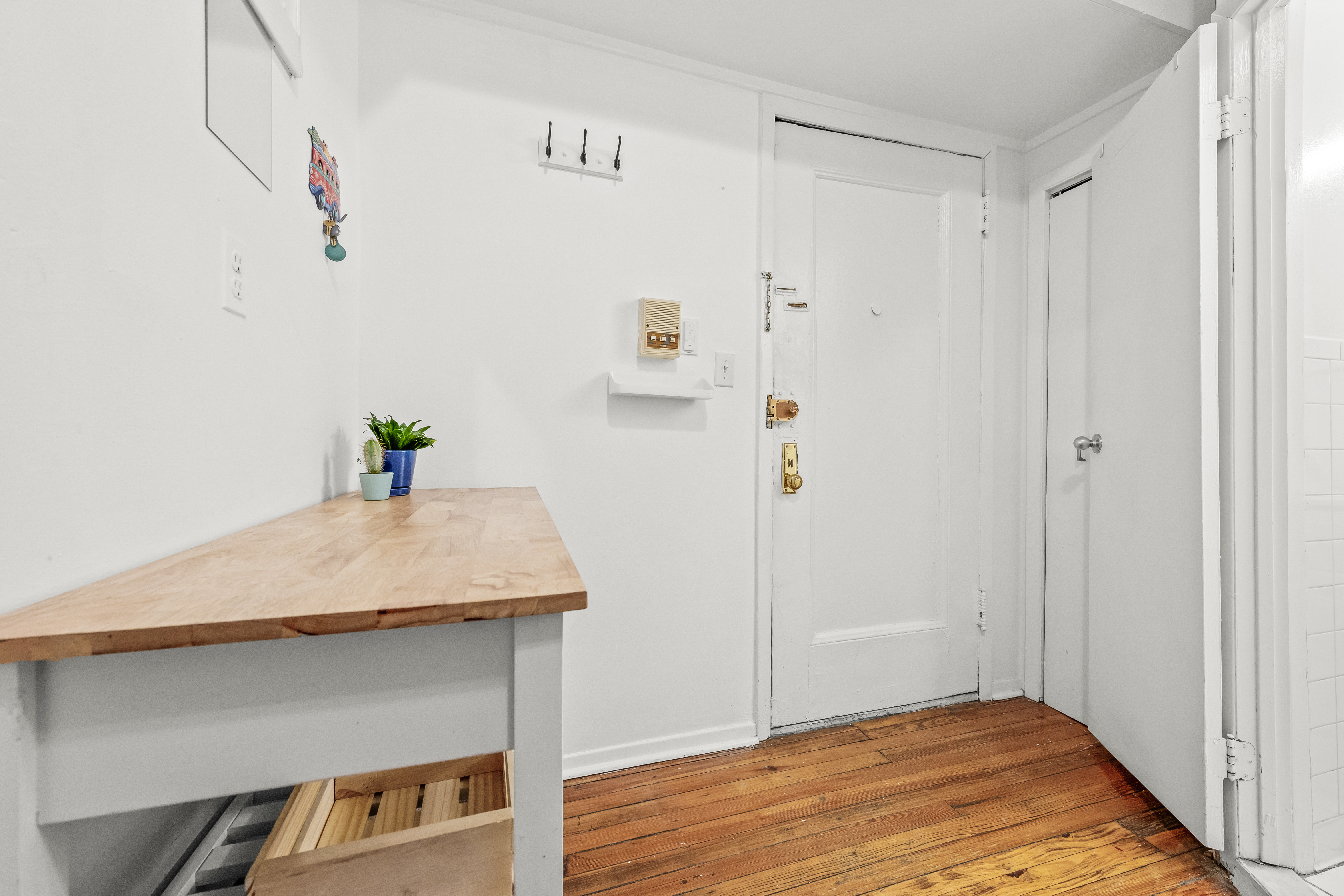 204 West 10th Street, Unit 7A Manhattan, NY 10014 - Photo 10 of 17 a room with a table and wooden floor