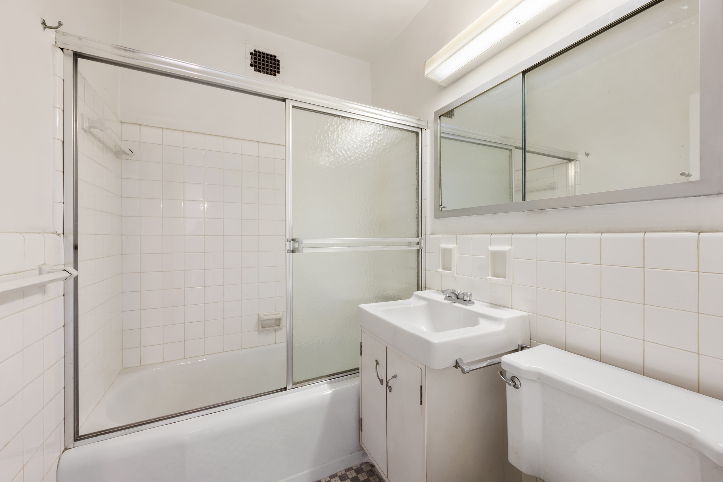 16 Sutton Place, Unit 15C Manhattan, NY 10022 - Photo 6 of 13 a bathroom with a sink toilet and shower