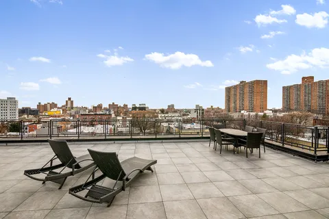 a view of a terrace with sitting area