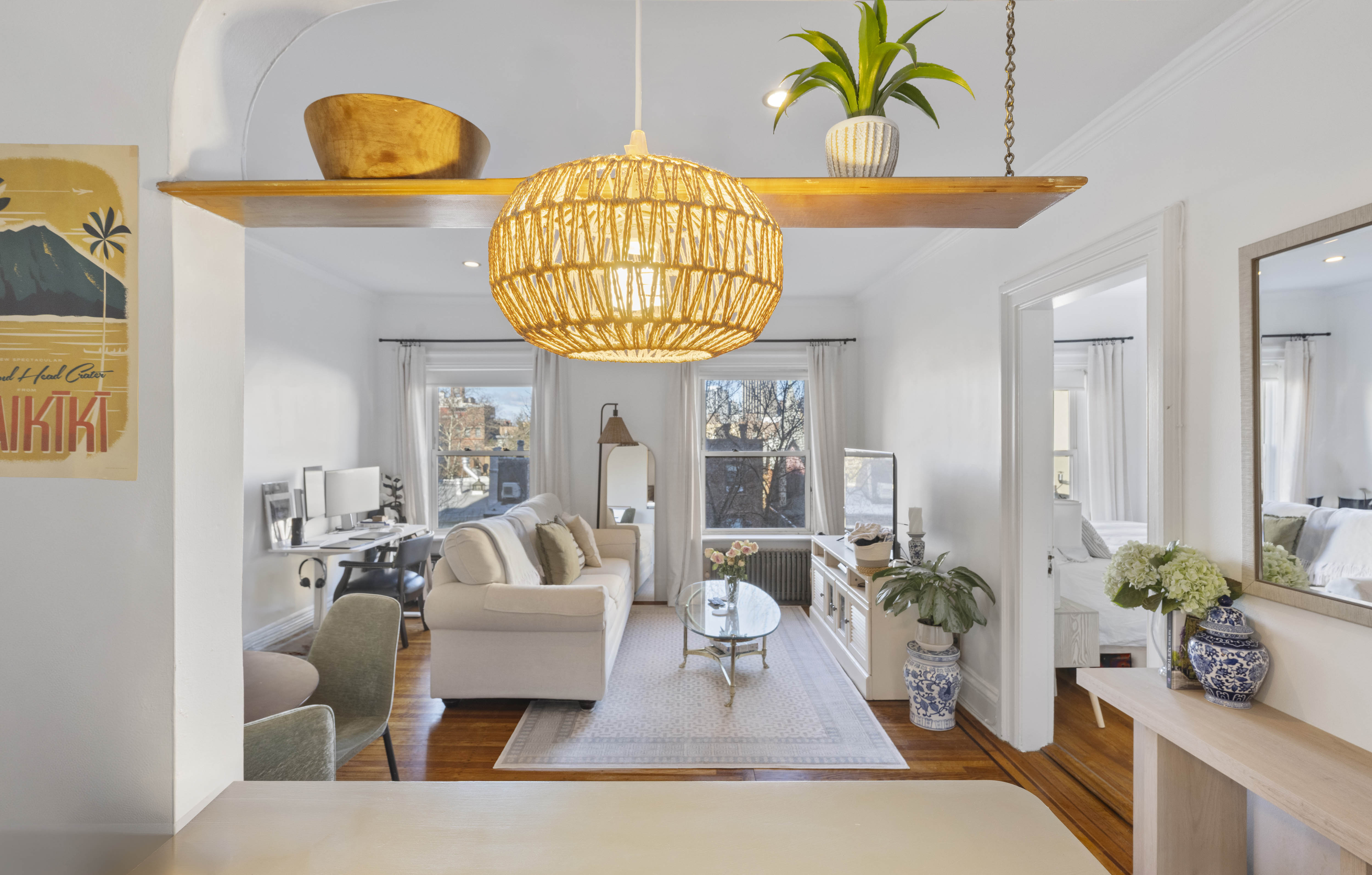 a living room with furniture and a chandelier