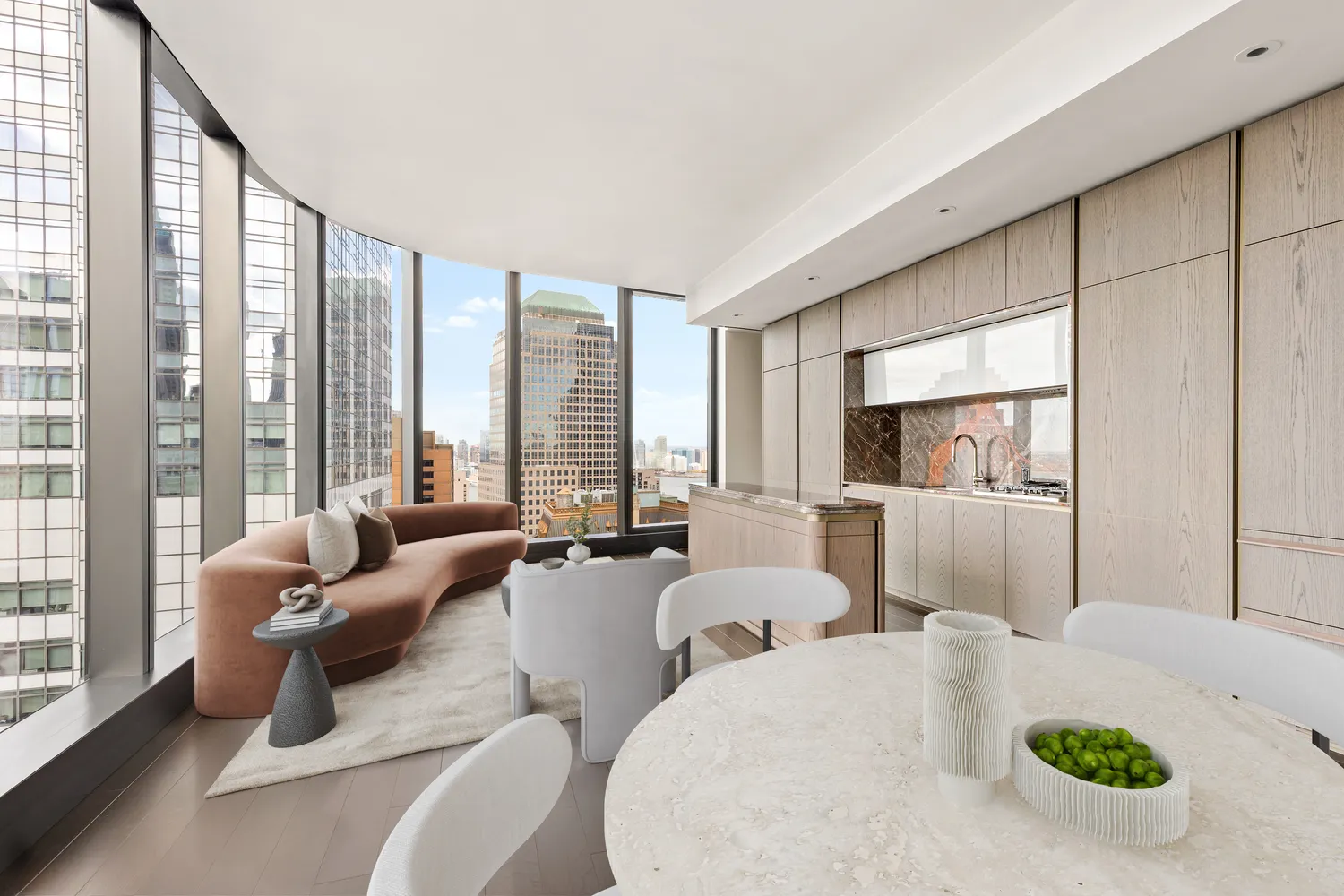 a living room with furniture and large windows