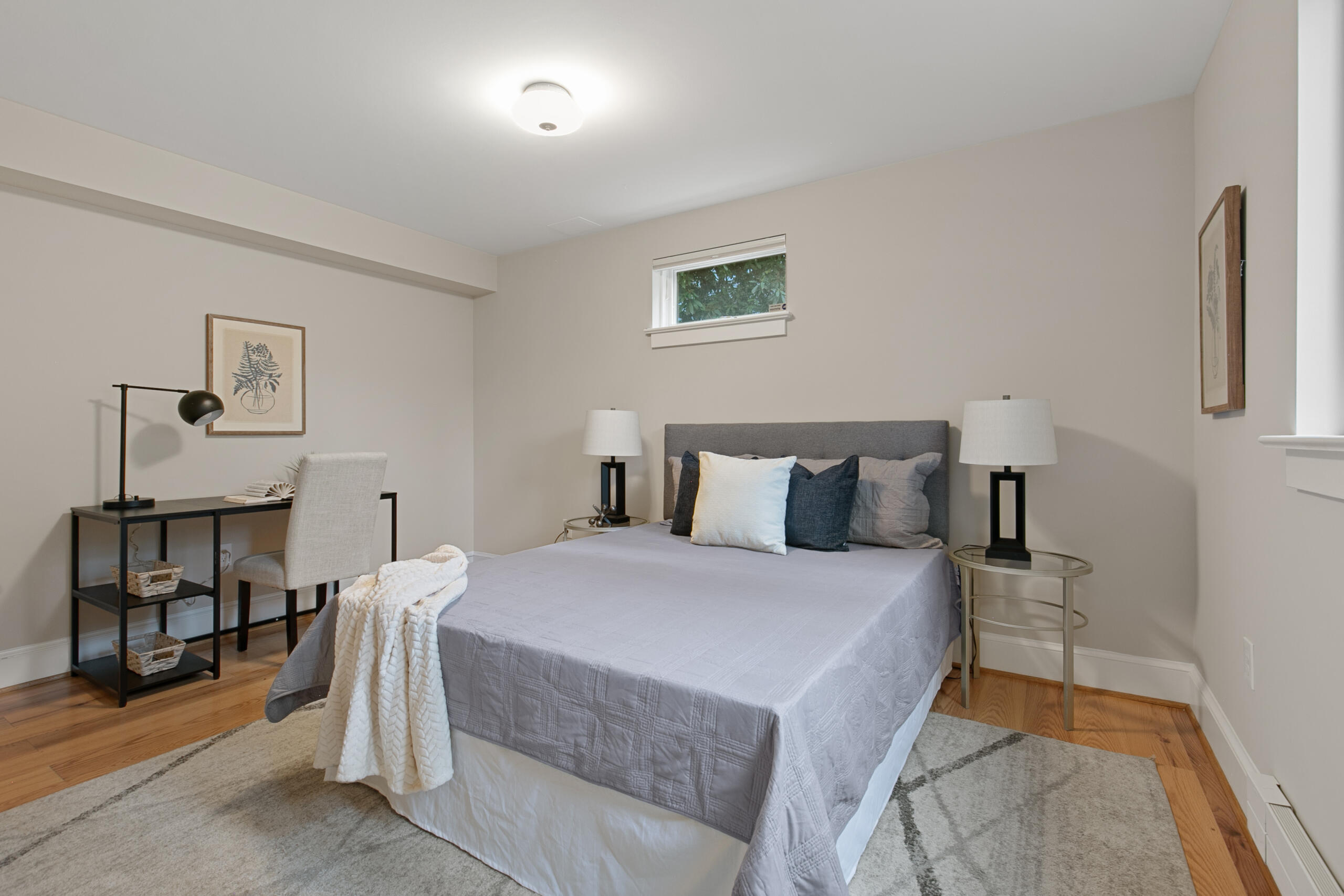 1908 Glen Ross Road Silver Spring, MD 20910 - Photo 45 of 63 a bedroom with a bed and a table