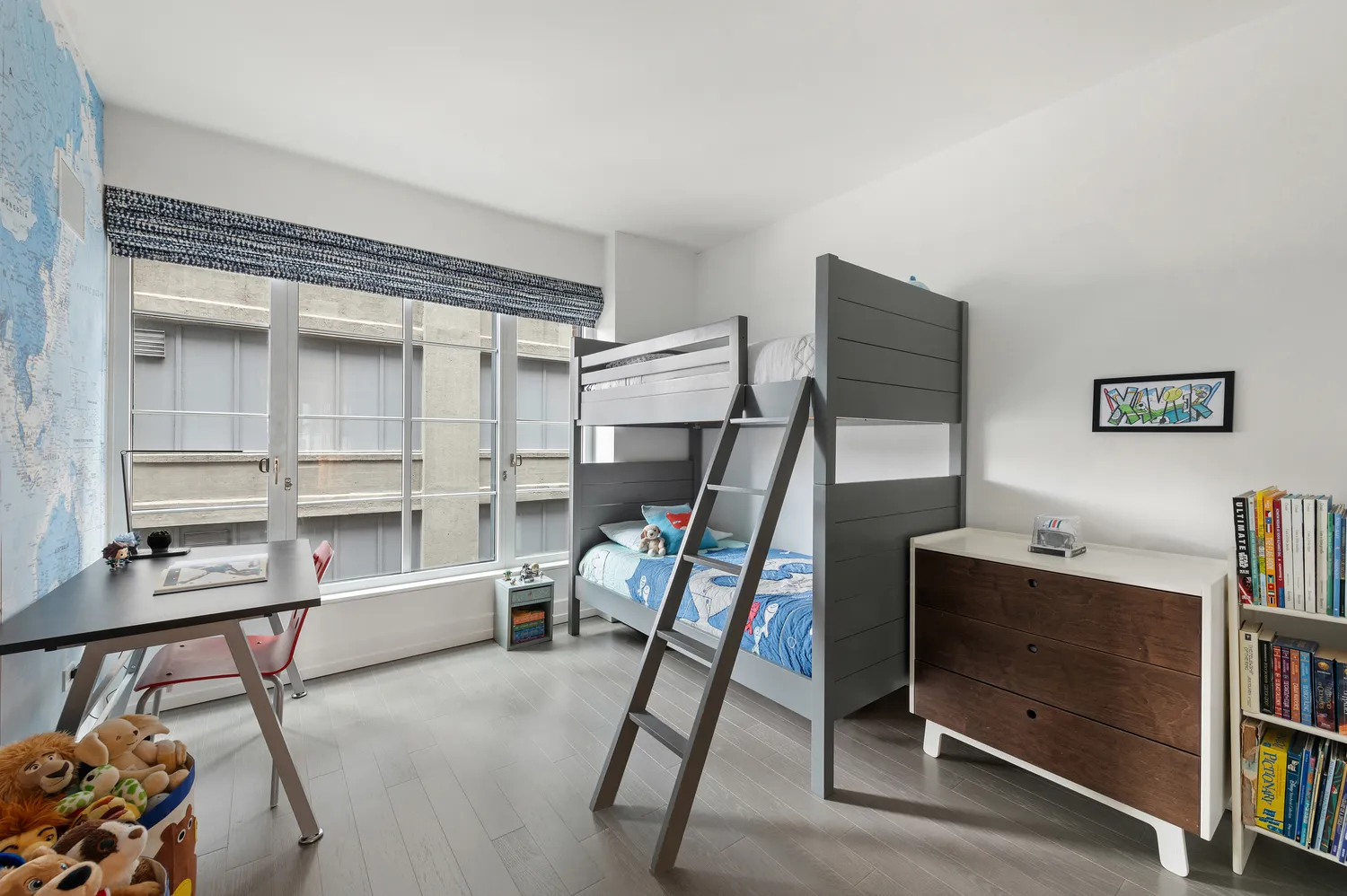 a bedroom with furniture and a window