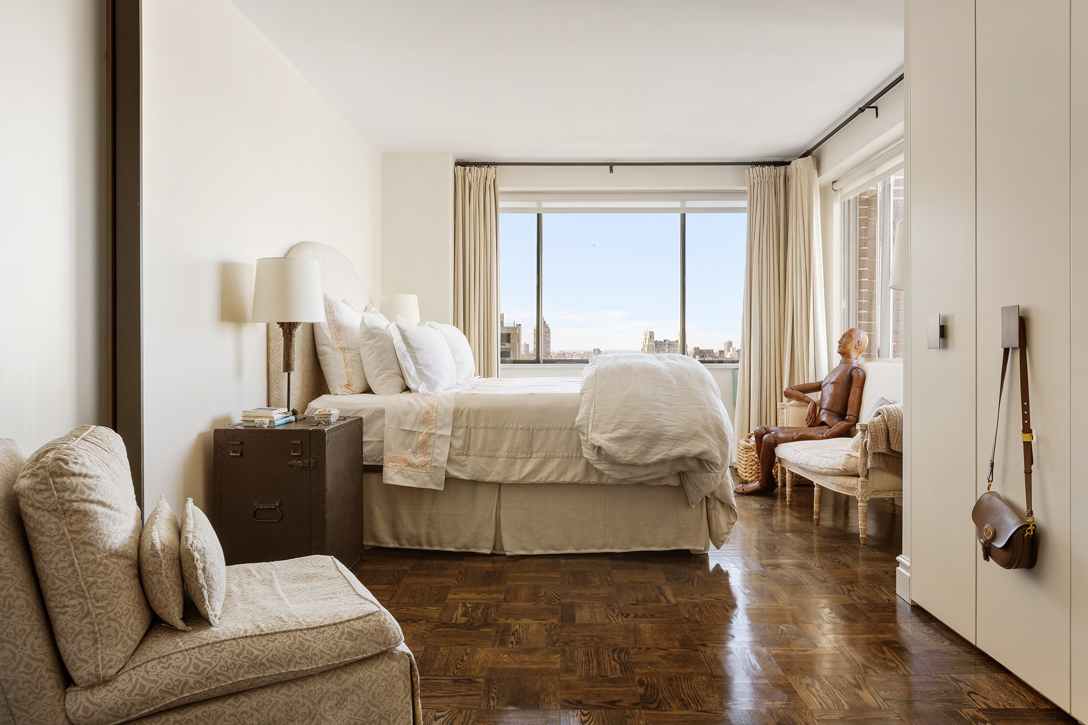 40 East 80th Street, Unit 24A Manhattan, NY 10075 - Photo 5 of 11 a bedroom with a bed and wooden floor
