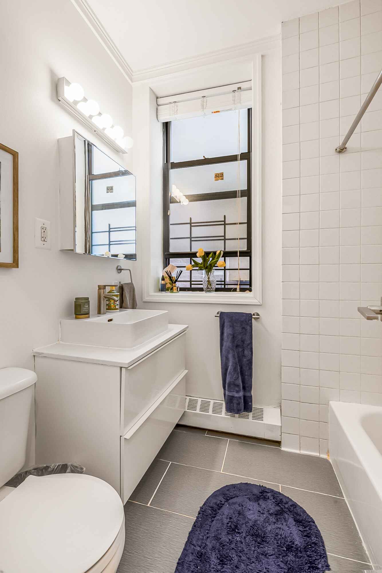 108 West 114th Street, Unit 4B Manhattan, NY 10026 - Photo 10 of 11 a bathroom with a sink a toilet and tub