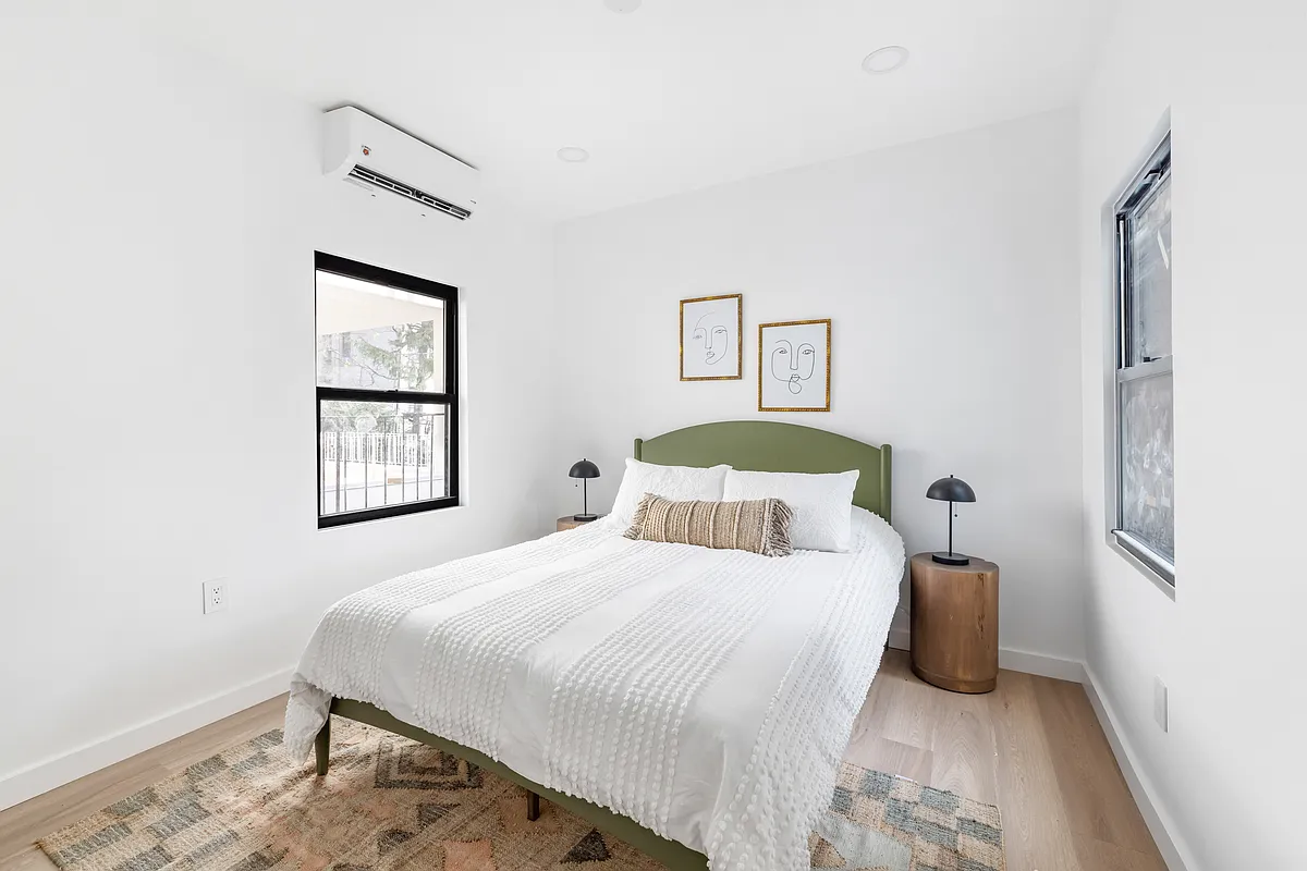 76 Meserole Avenue, Unit 2A Brooklyn, NY 11222 - Photo 6 of 10 a bedroom with a bed and a window