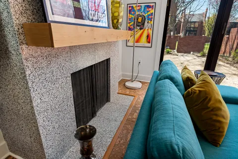 a living room with furniture and a floor to ceiling window