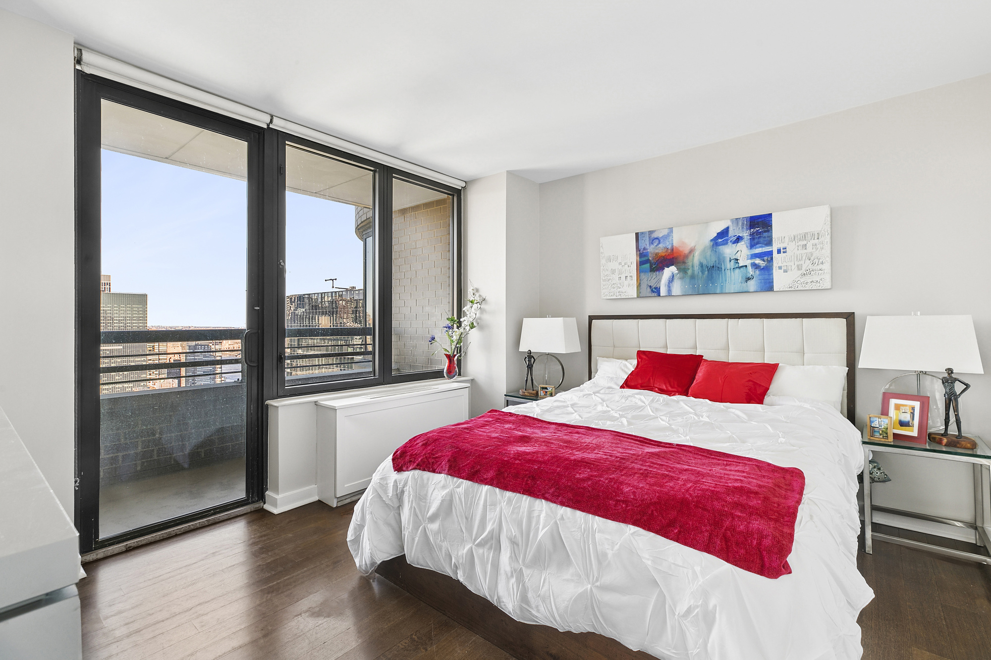 330 East 38th Street, Unit 50E Manhattan, NY 10016 - Photo 7 of 8 a bedroom with a large bed and a large window