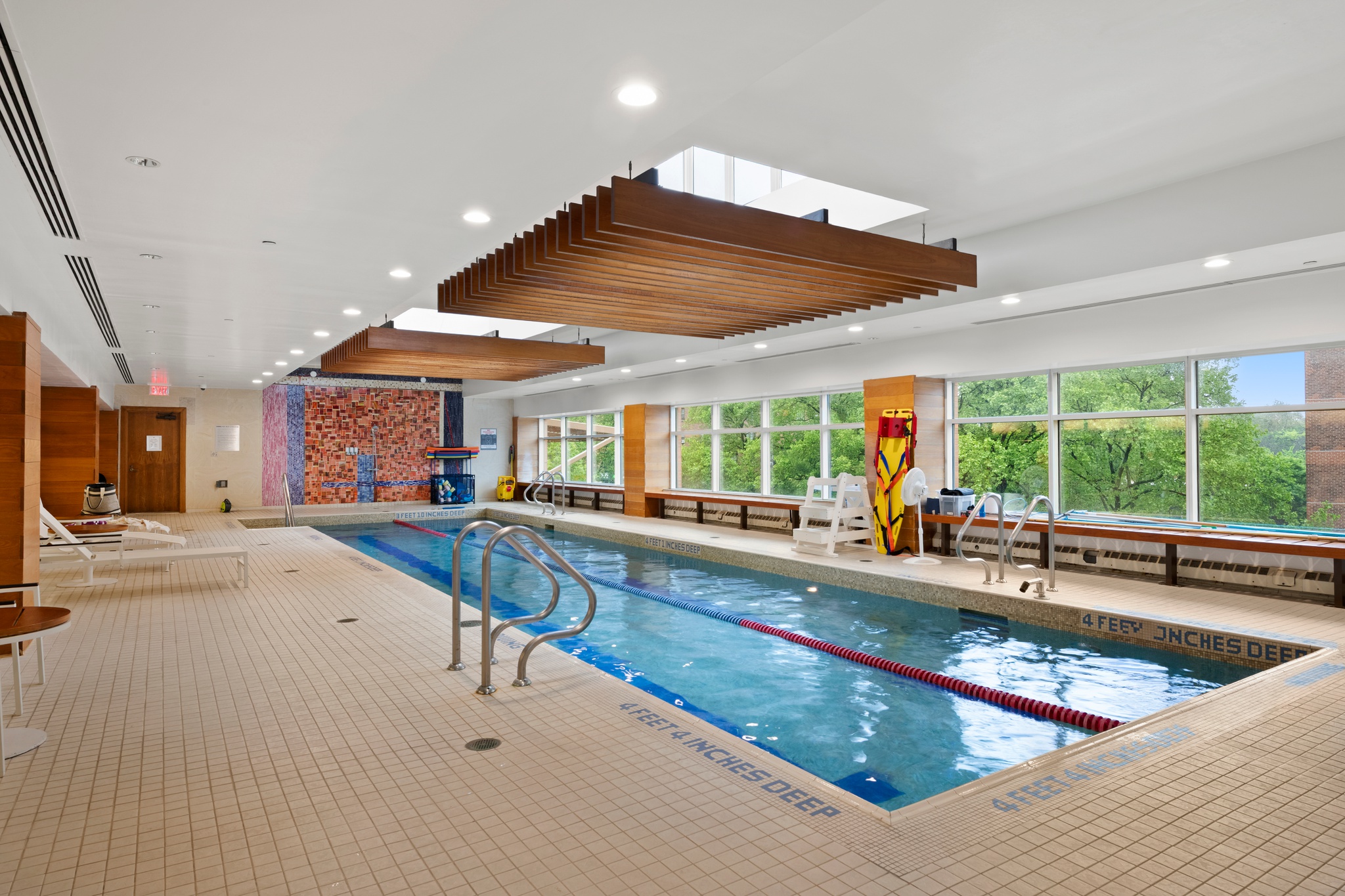 215-217 East 96th Street, Unit 40E Manhattan, NY 10128 - Photo 6 of 7 a living room with furniture pool table and large windows