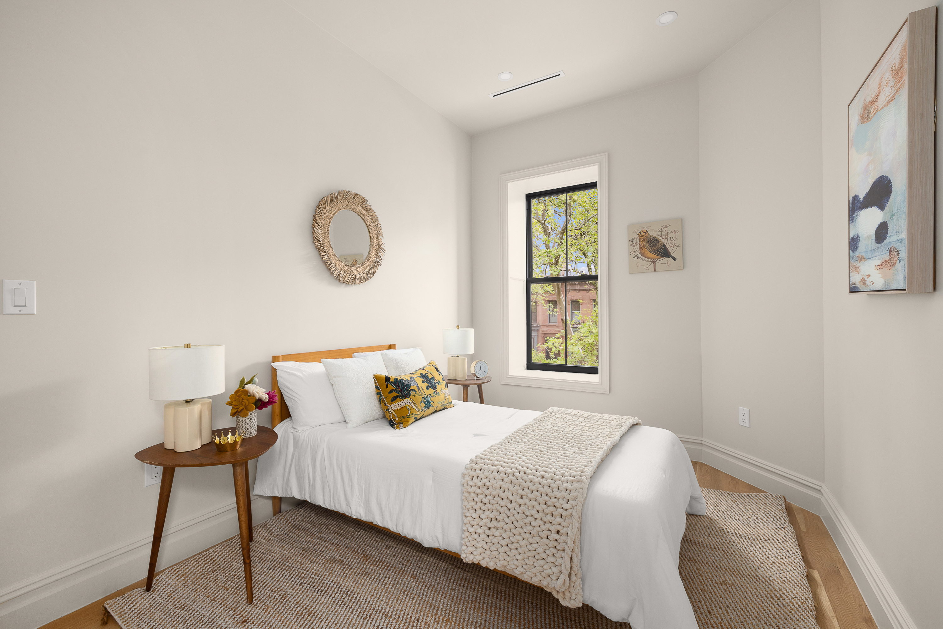 559 MacDonough Street Brooklyn, NY 11233 - Photo 12 of 17 a bedroom with a bed and a window