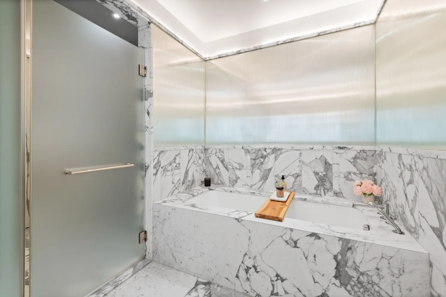 a bathroom with a bathtub and shower