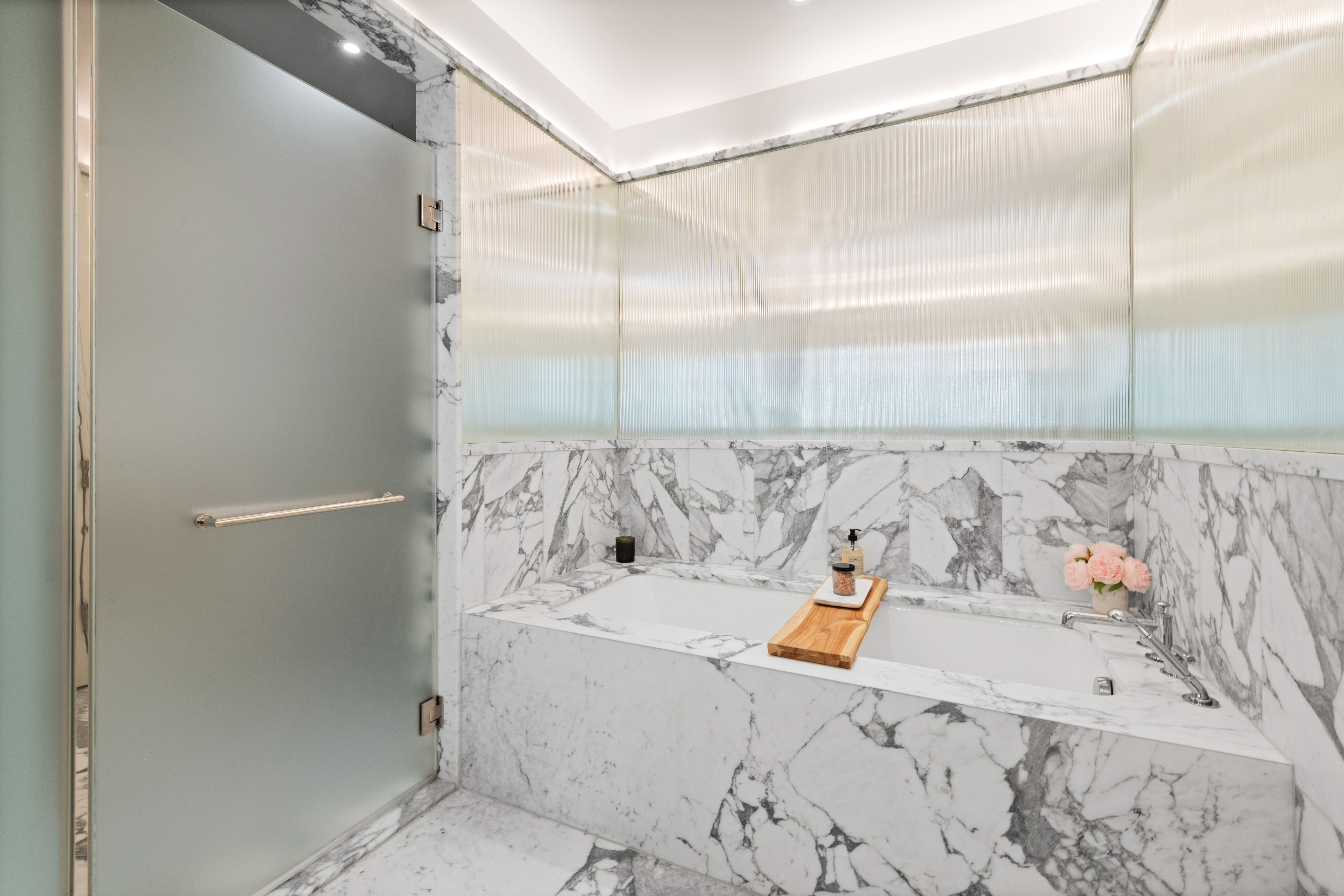 40 East End Avenue, Unit 9B Manhattan, NY 10028 - Photo 11 of 25 a bathroom with a bathtub and shower