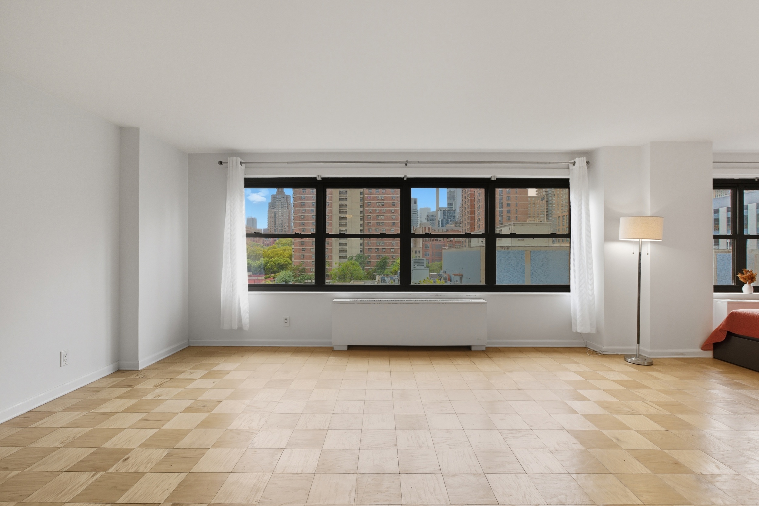 140 West End Avenue, Unit 6D Manhattan, NY 10023 - Photo 8 of 19 a view of an empty room with a window
