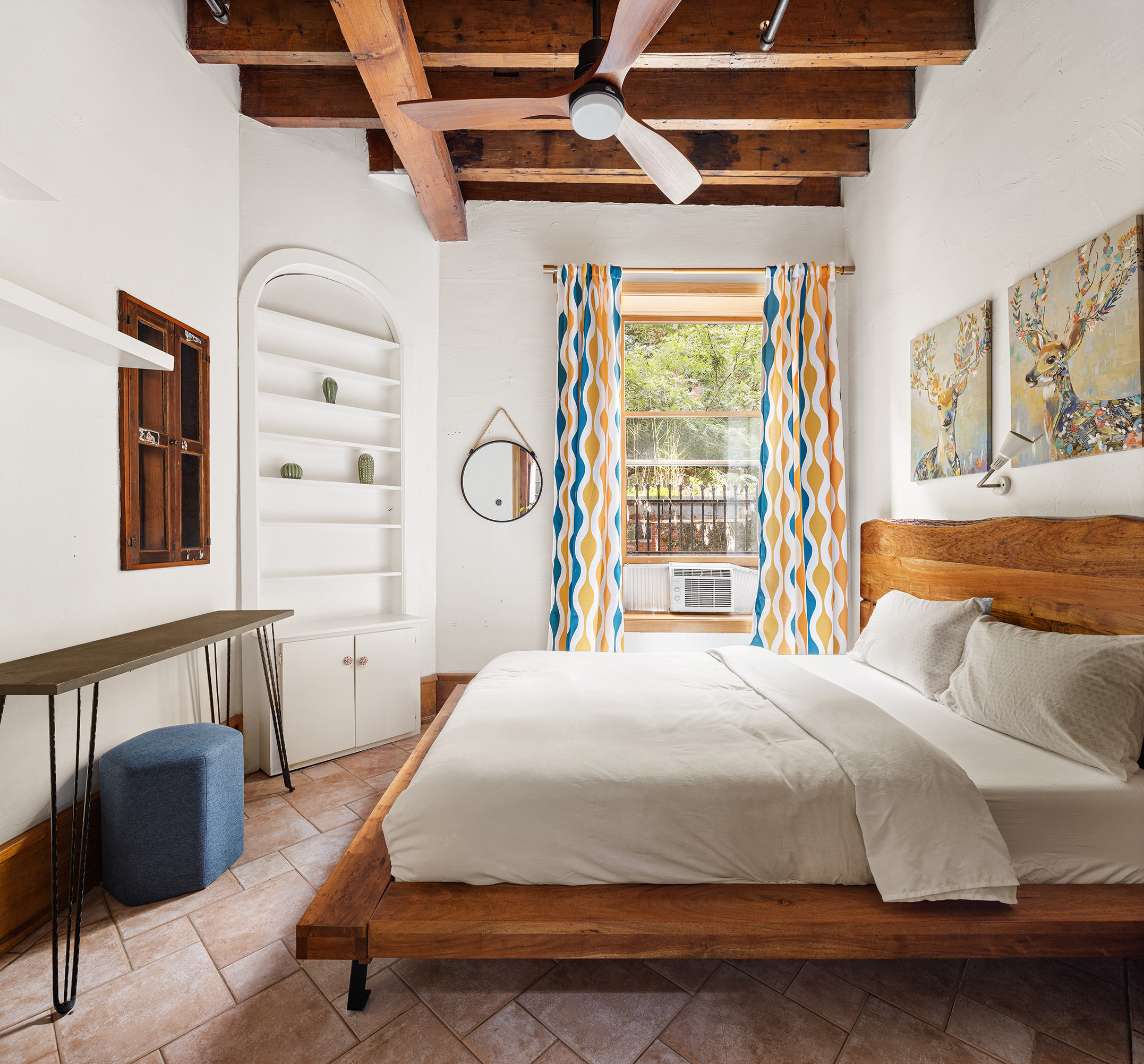 170 Eldridge Street Manhattan, NY 10002 - Photo 13 of 19 a bedroom with a bed a dresser and chair